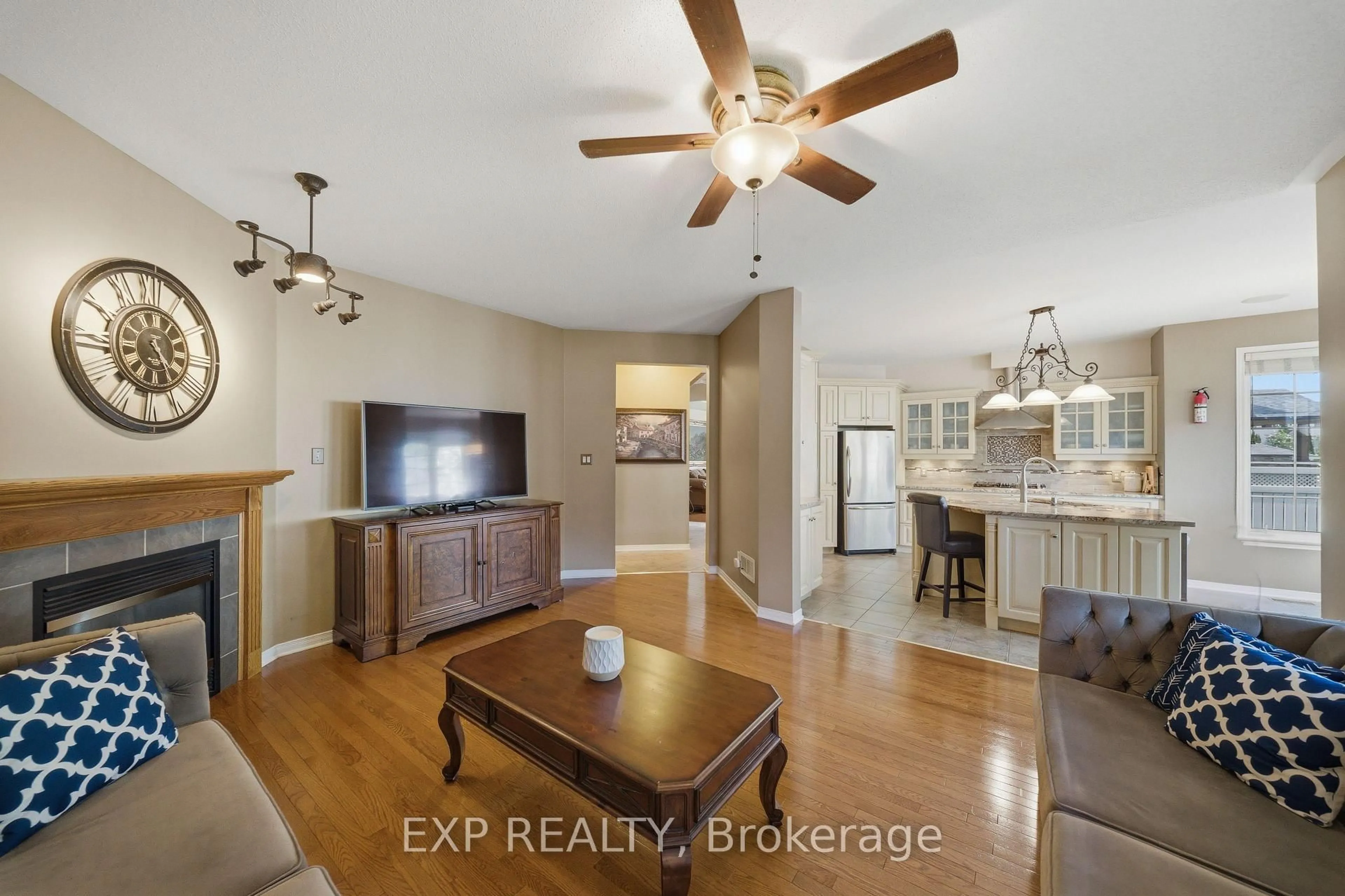 Living room with furniture, wood/laminate floor for 49 Pondhollow Way, Ottawa Ontario K2J 5E4