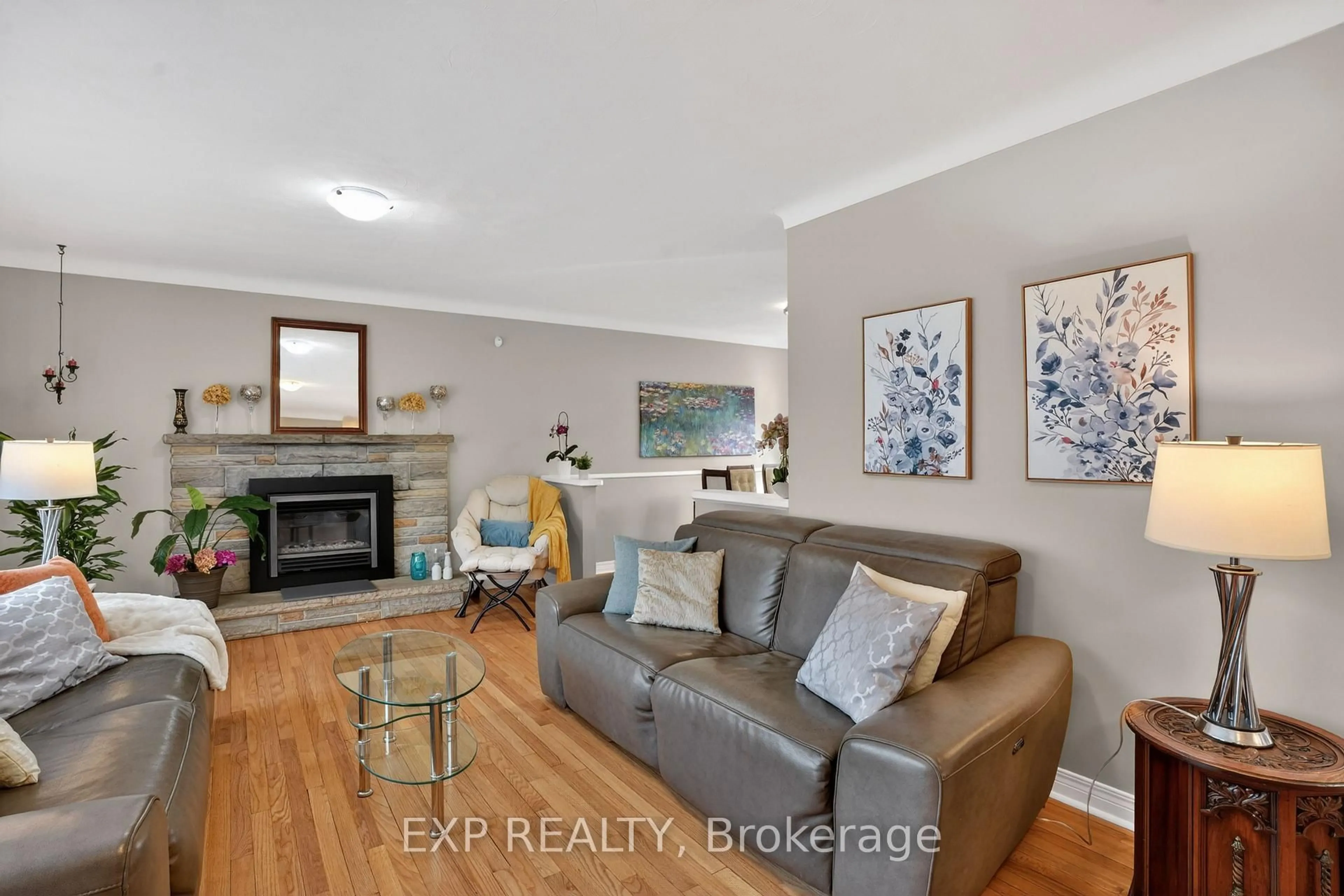Living room with furniture, wood/laminate floor for 4 Wolmsley Cres, Ottawa Ontario K2G 1J4