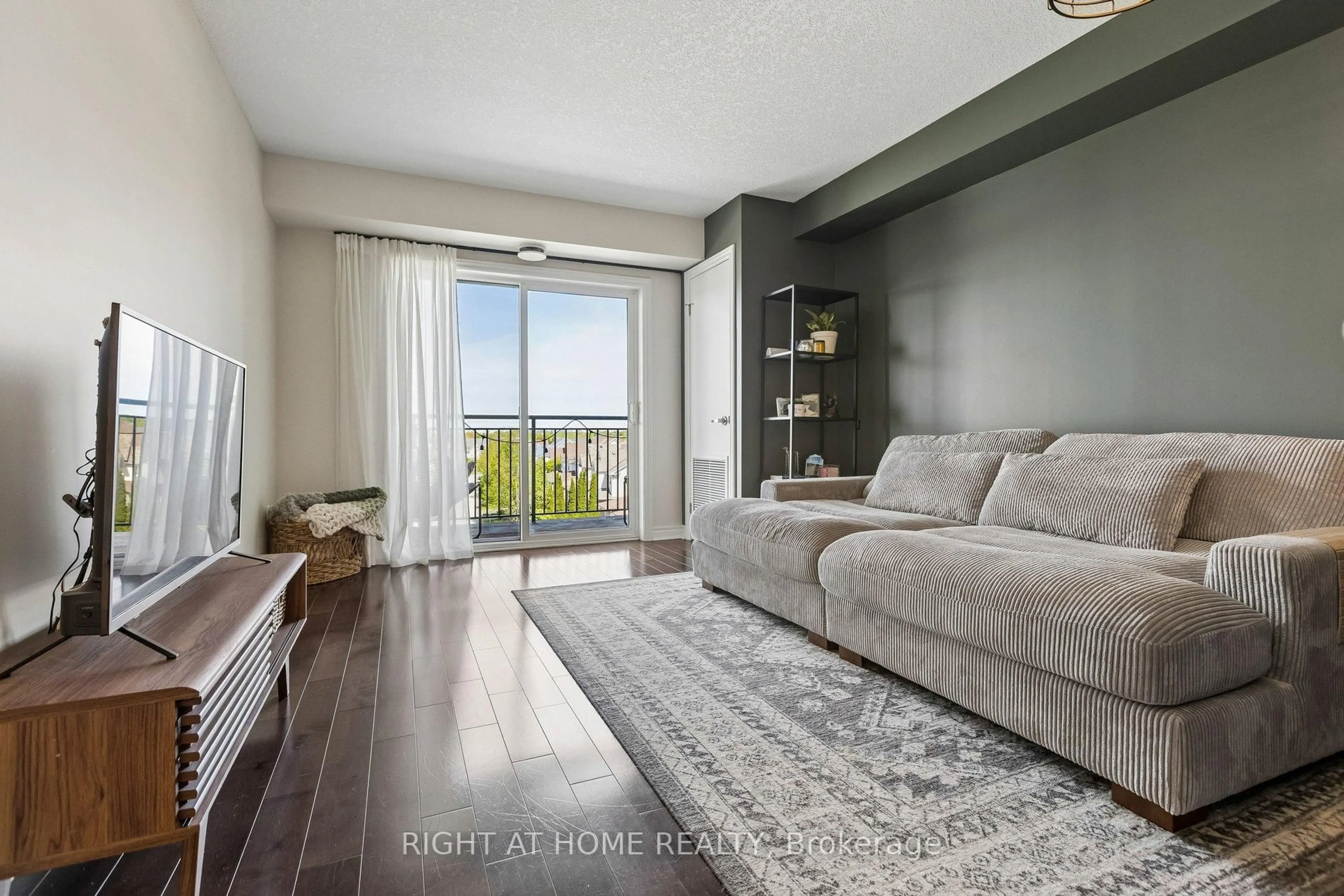 Living room with furniture, wood/laminate floor for 37 Goodwin Dr, Guelph Ontario N1L 0E6