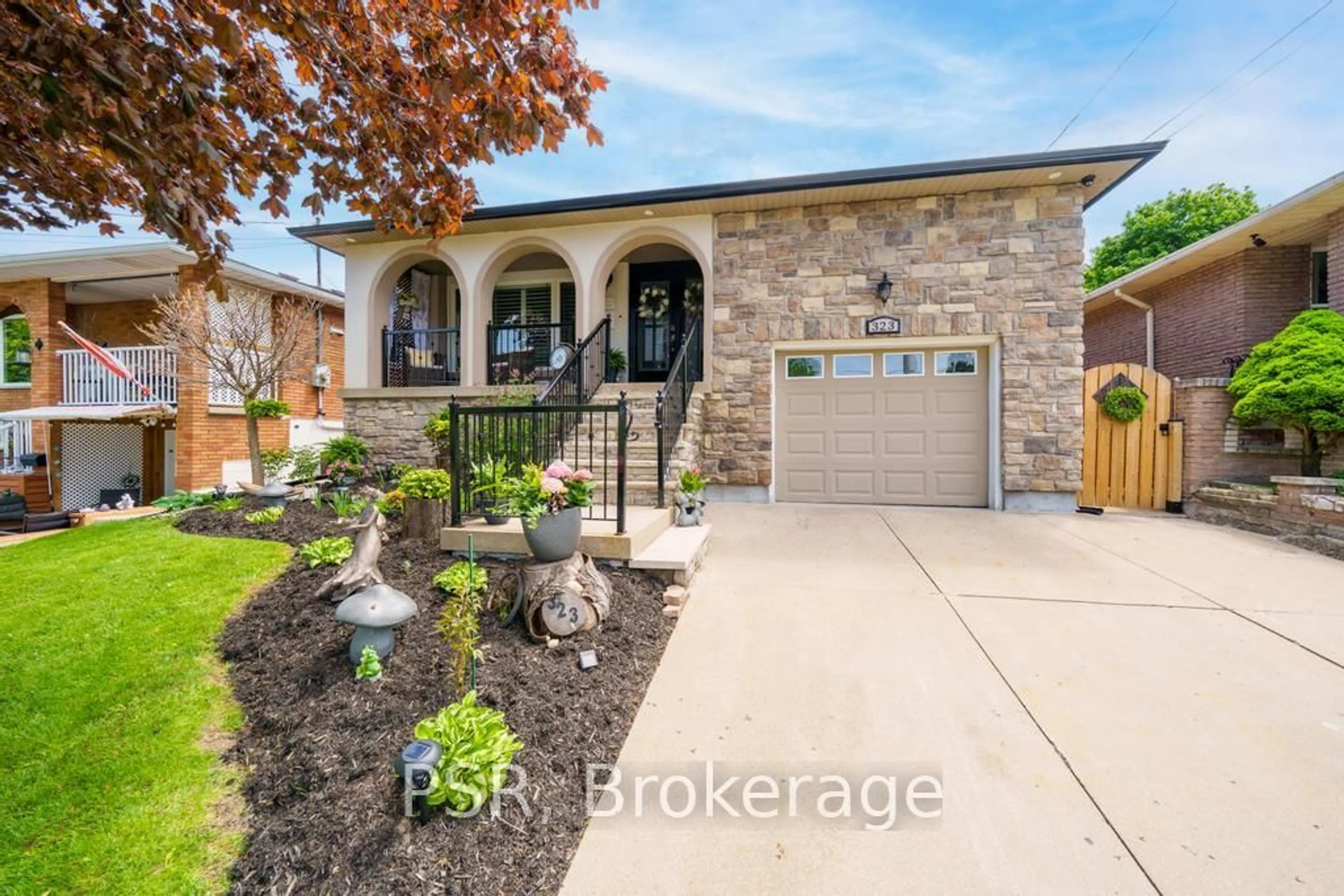 Home with brick exterior material, street for 323 Queen Victoria Dr, Hamilton Ontario L8W 1G6