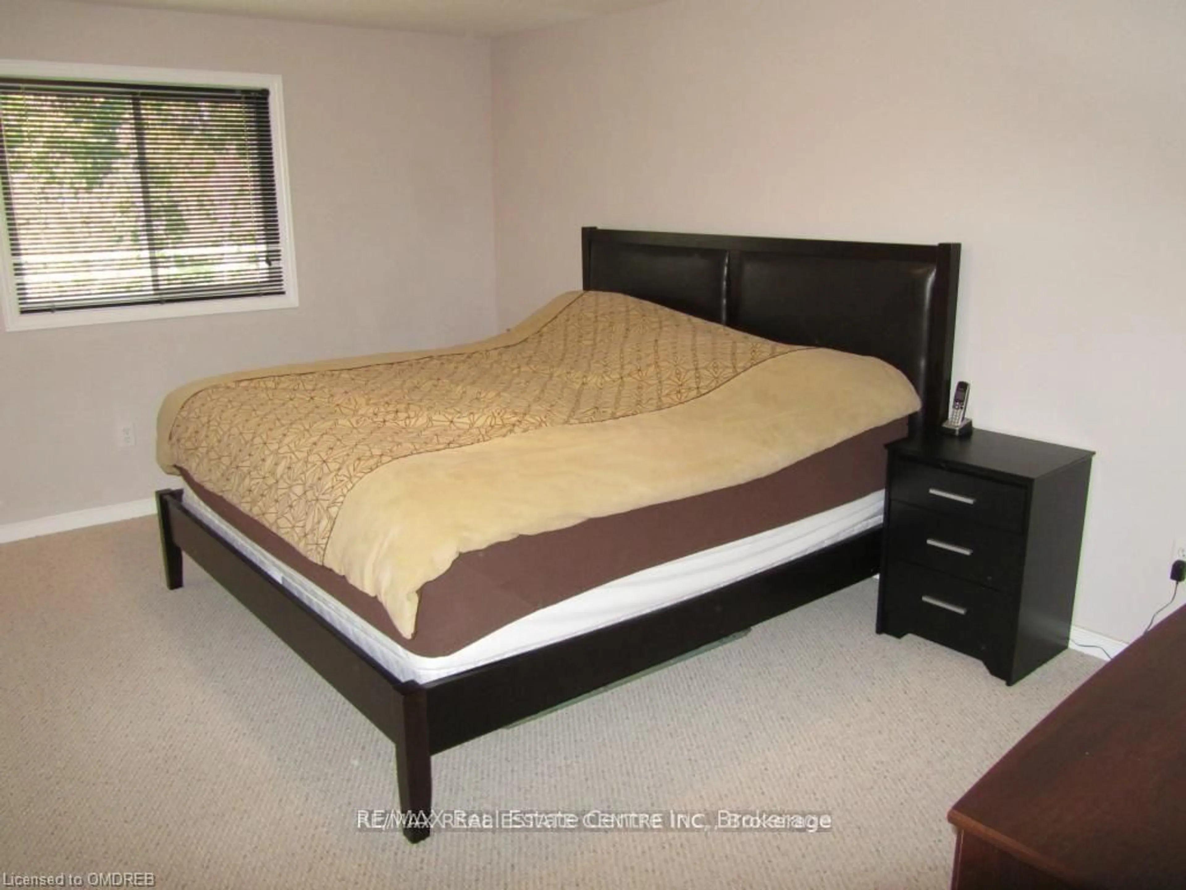 Bedroom with bed, wood/laminate floor for 292 Briarmeadow Dr, Kitchener Ontario N2A 4L1