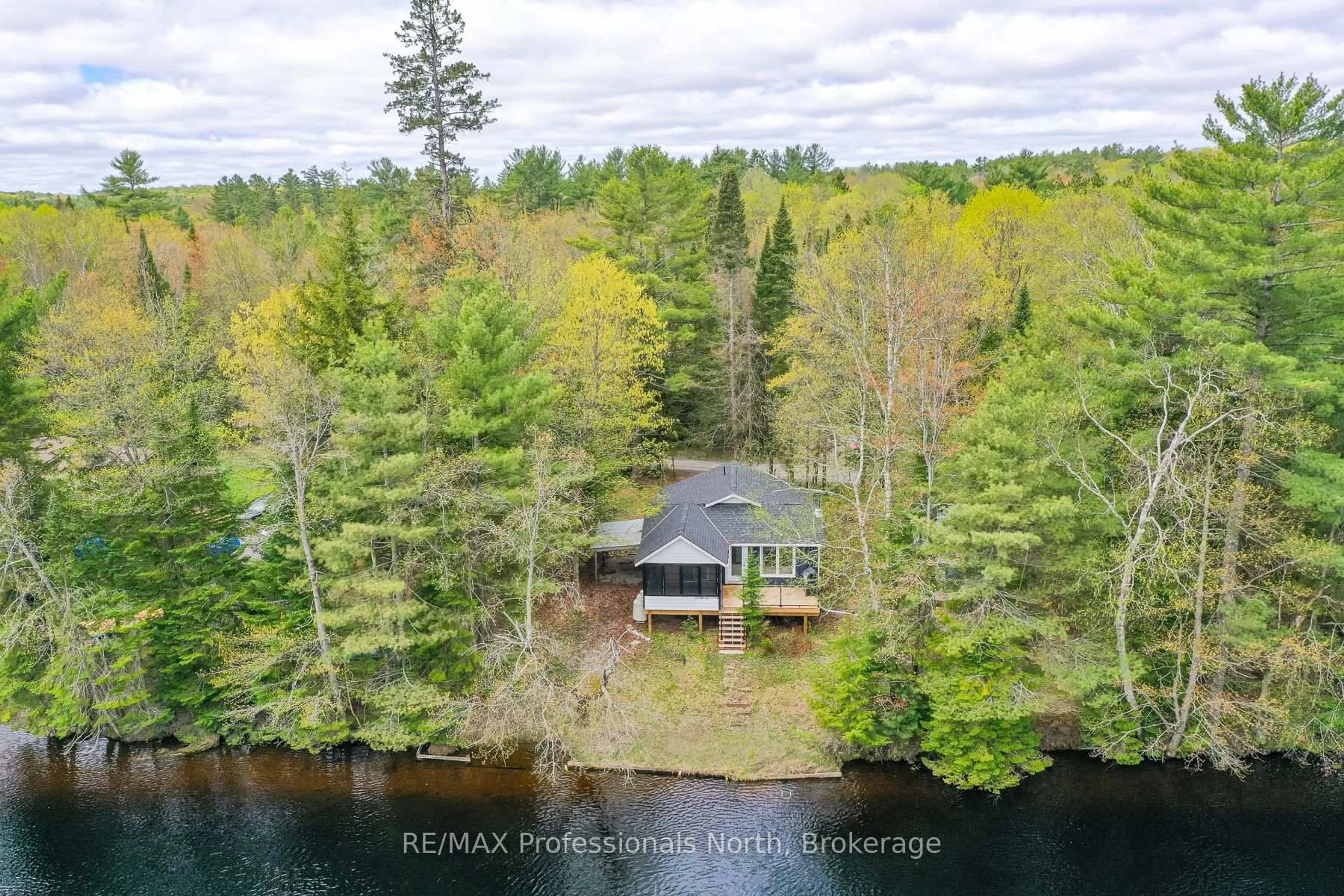 A pic from outside/outdoor area/front of a property/back of a property/a pic from drone, water/lake/river/ocean view for 1011 Harmony Lane Private, Bracebridge Ontario P1L 1W9