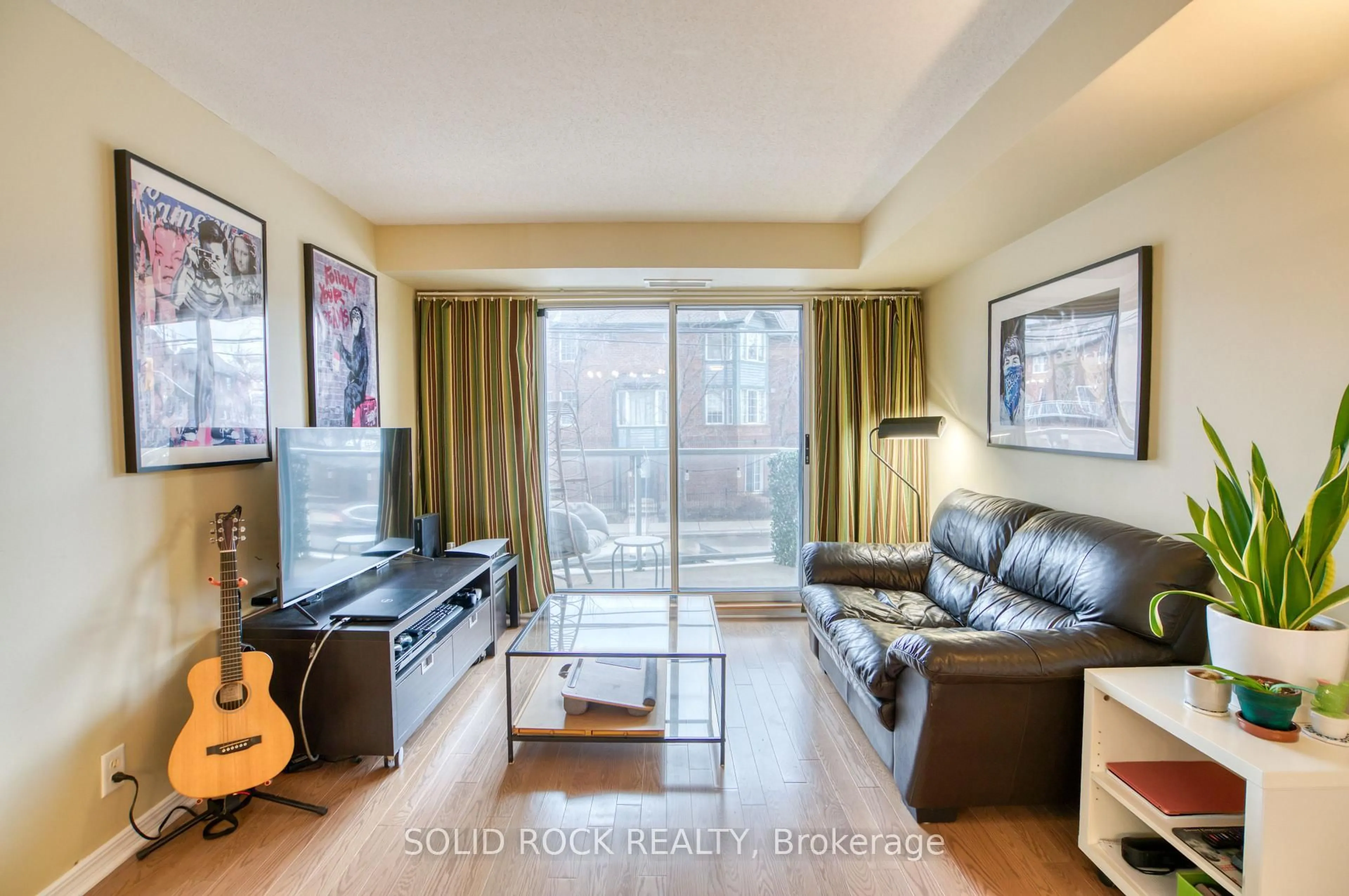 Living room with furniture, wood/laminate floor for 429 Somerset St #209, Ottawa Ontario K2P 2P5