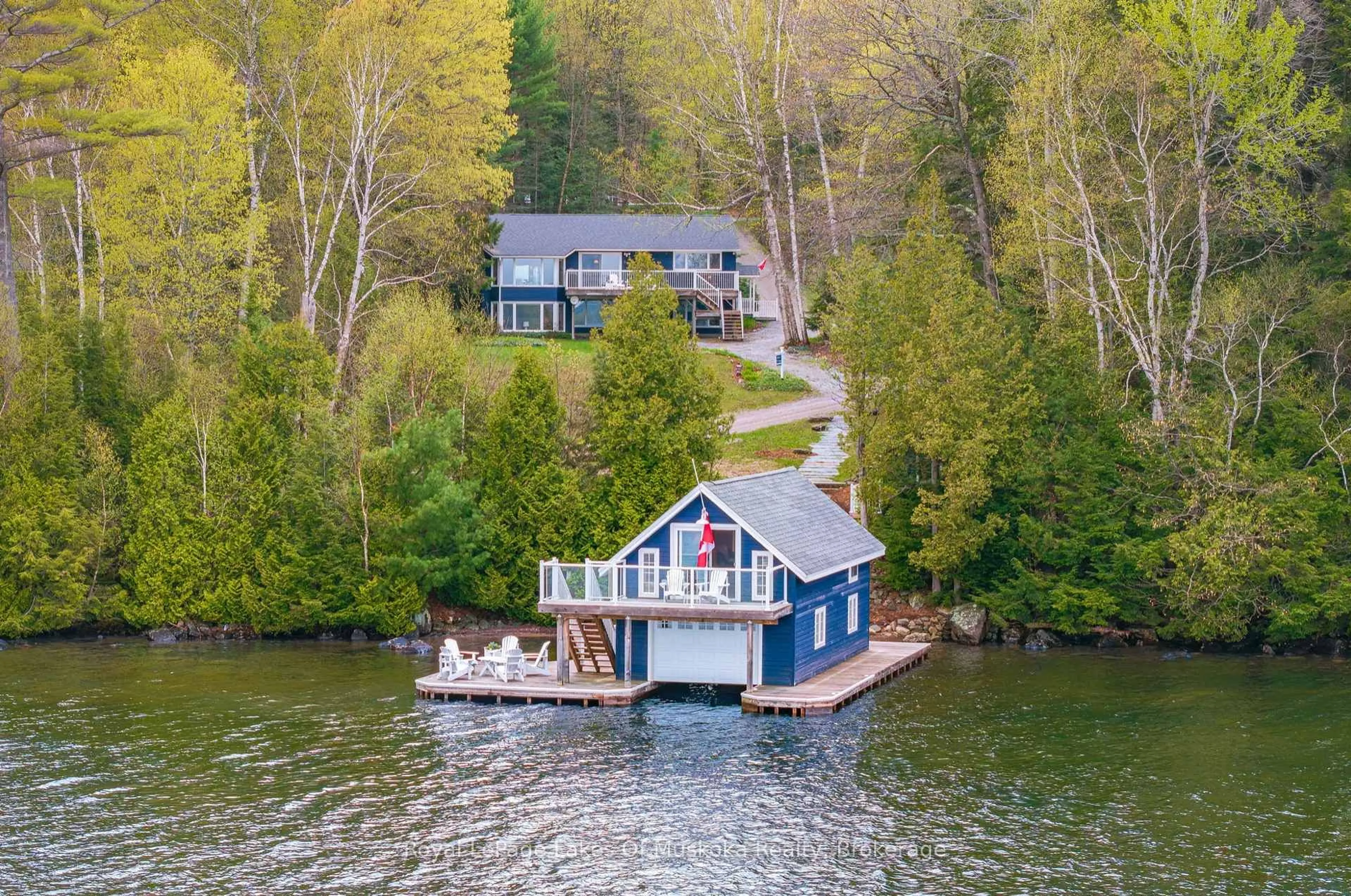 A pic from outside/outdoor area/front of a property/back of a property/a pic from drone, water/lake/river/ocean view for 1044 Bigwin View Lane, Lake of Bays Ontario P0B 1A0