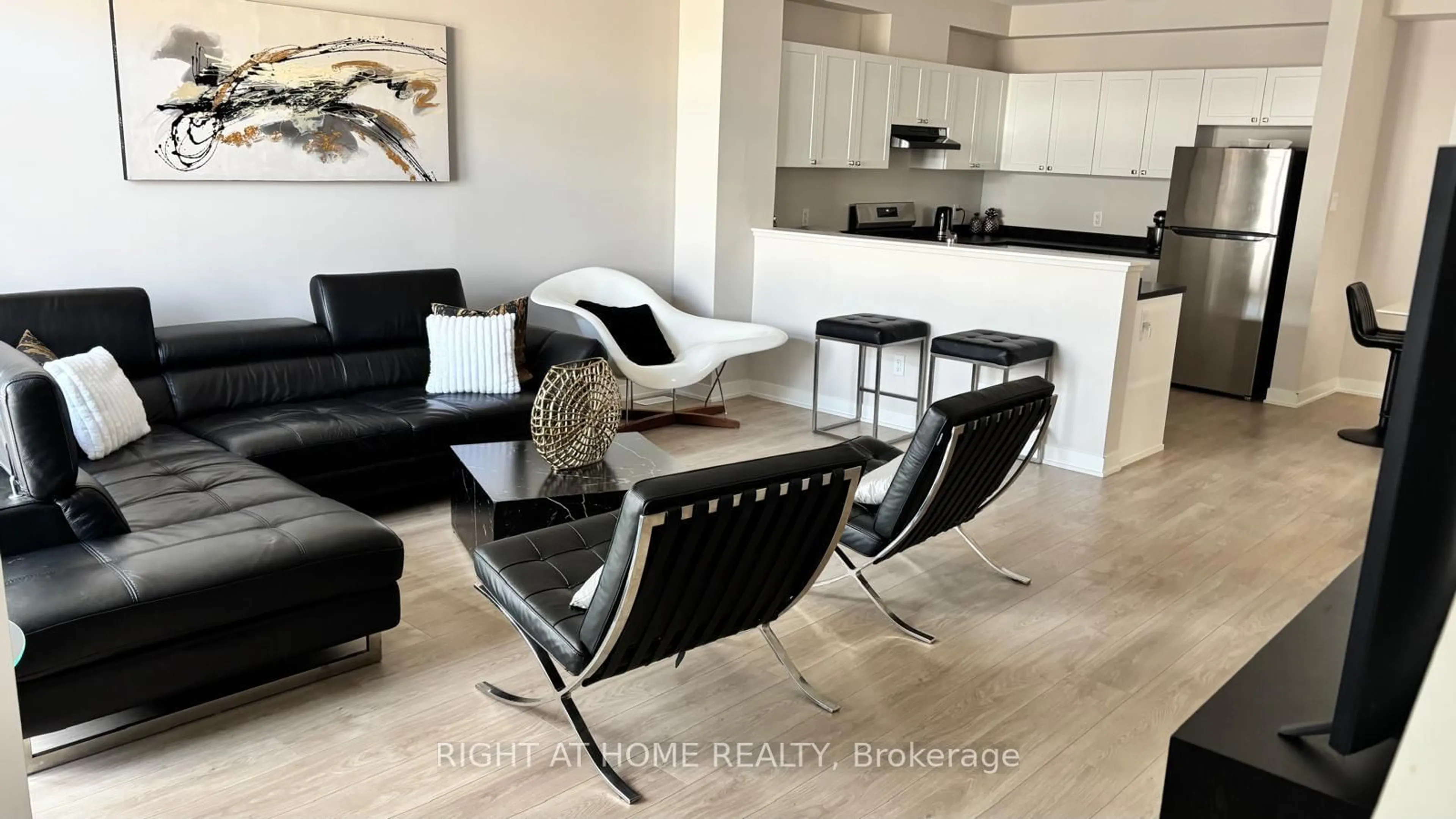 Living room with furniture, wood/laminate floor for 42 STITCH Mews, Richmond Ontario K0A 2Z0