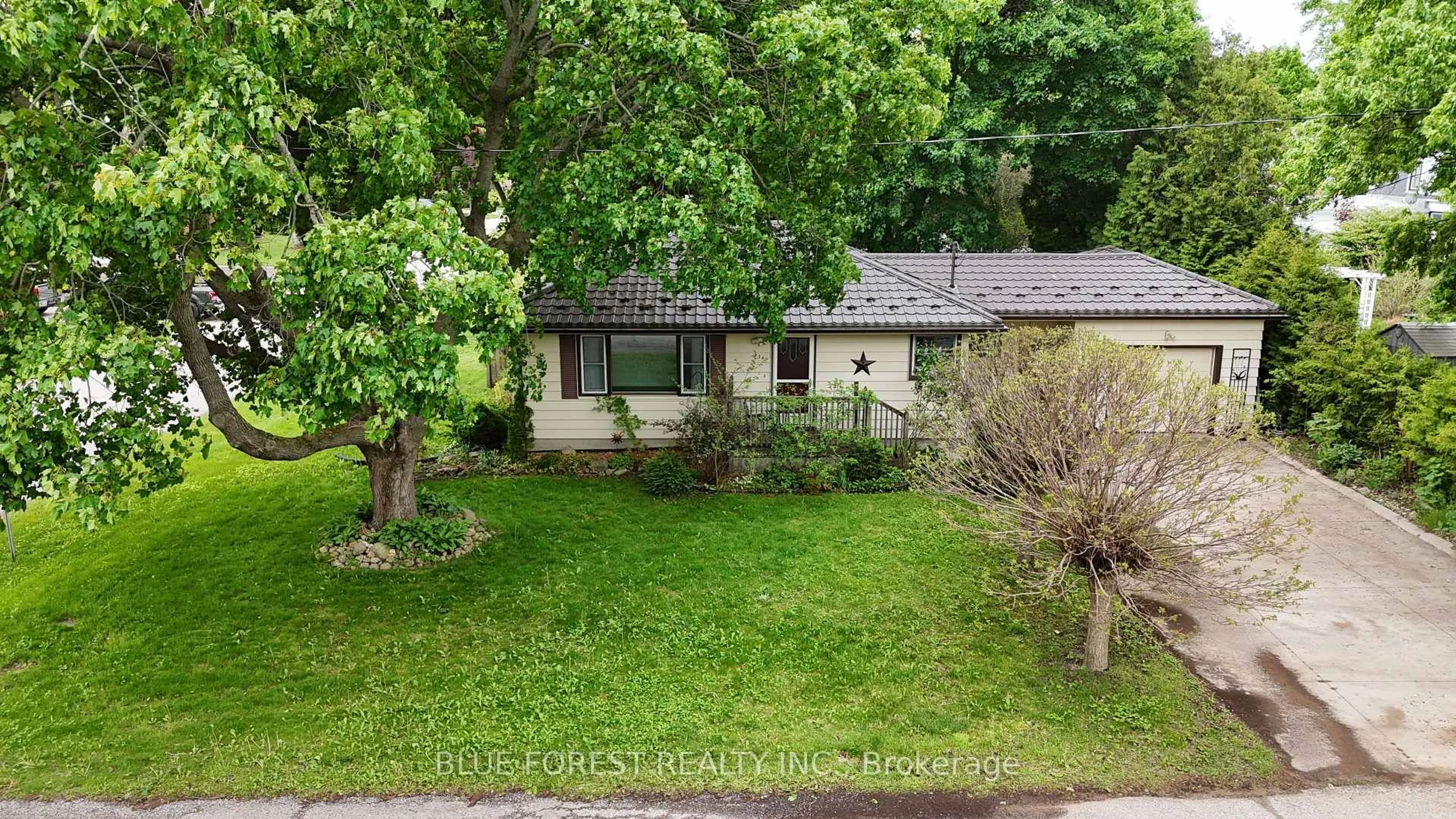 A pic from outside/outdoor area/front of a property/back of a property/a pic from drone, street for 234 Flora St, West Elgin Ontario N0L 2C0