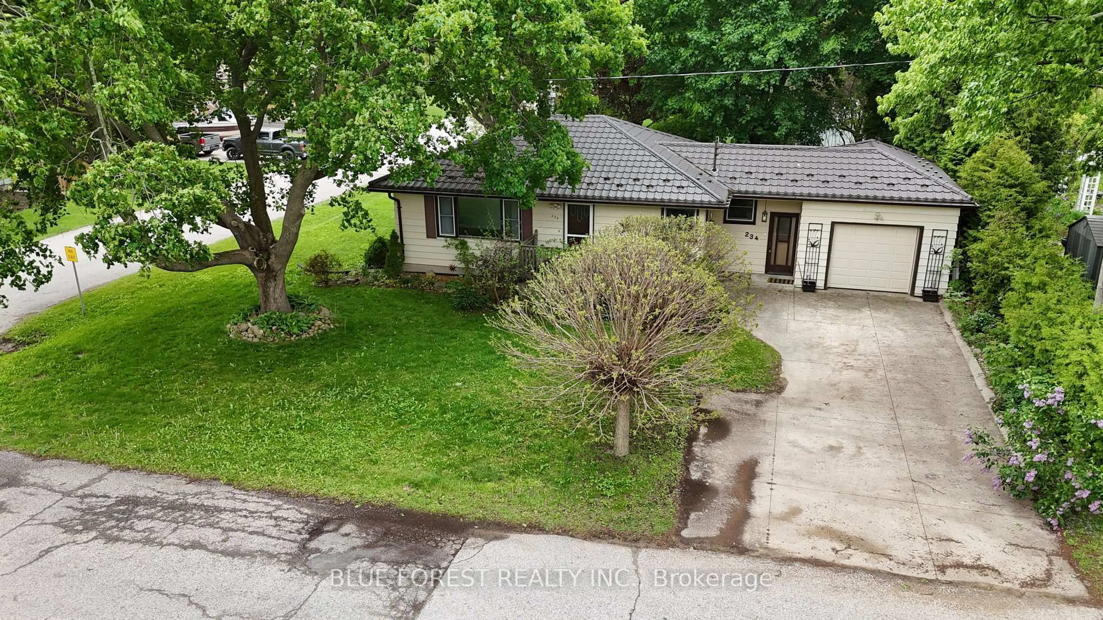 A pic from outside/outdoor area/front of a property/back of a property/a pic from drone, street for 234 Flora St, West Elgin Ontario N0L 2C0