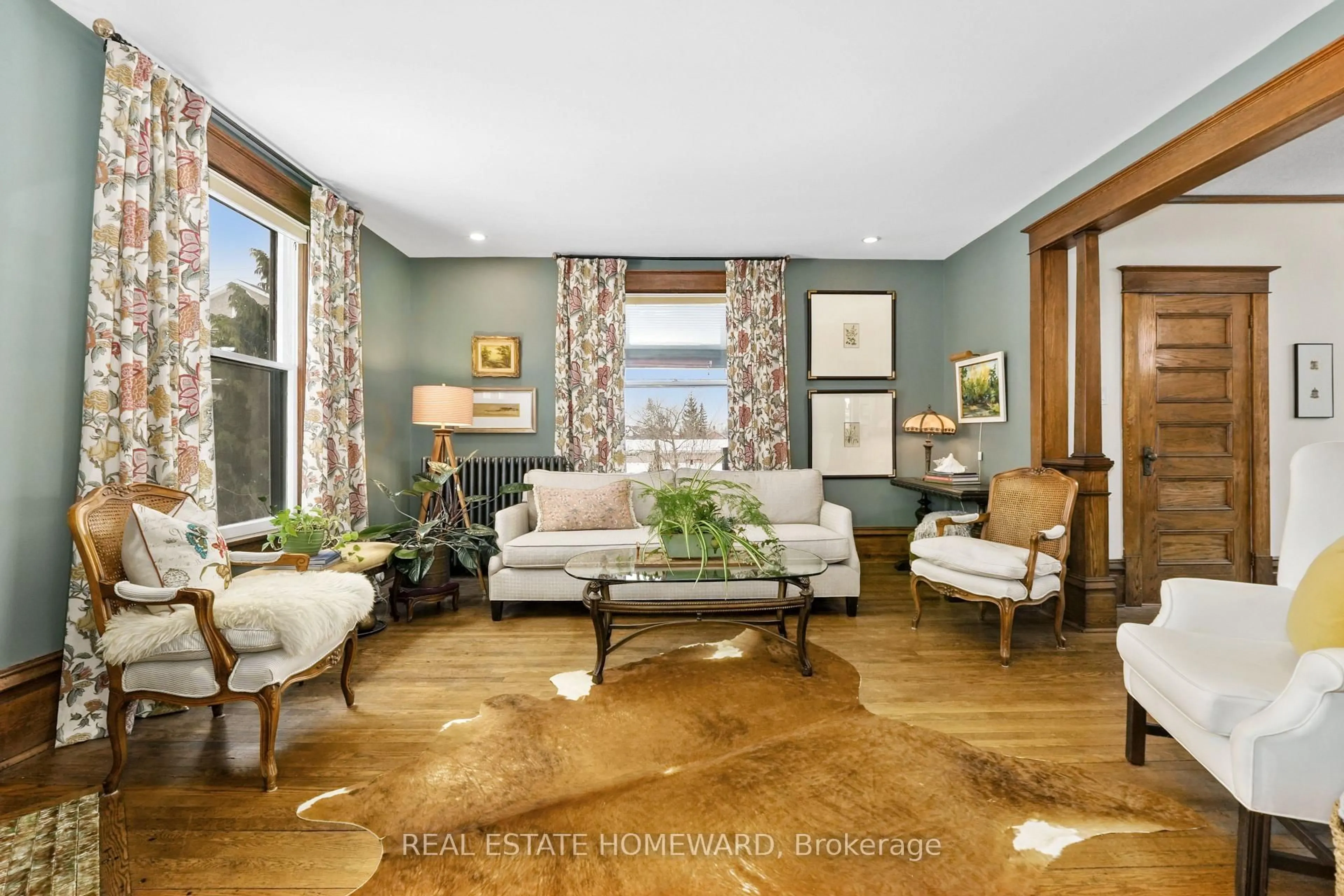 Living room with furniture, wood/laminate floor for 96 James St, Cobourg Ontario K9A 2K2