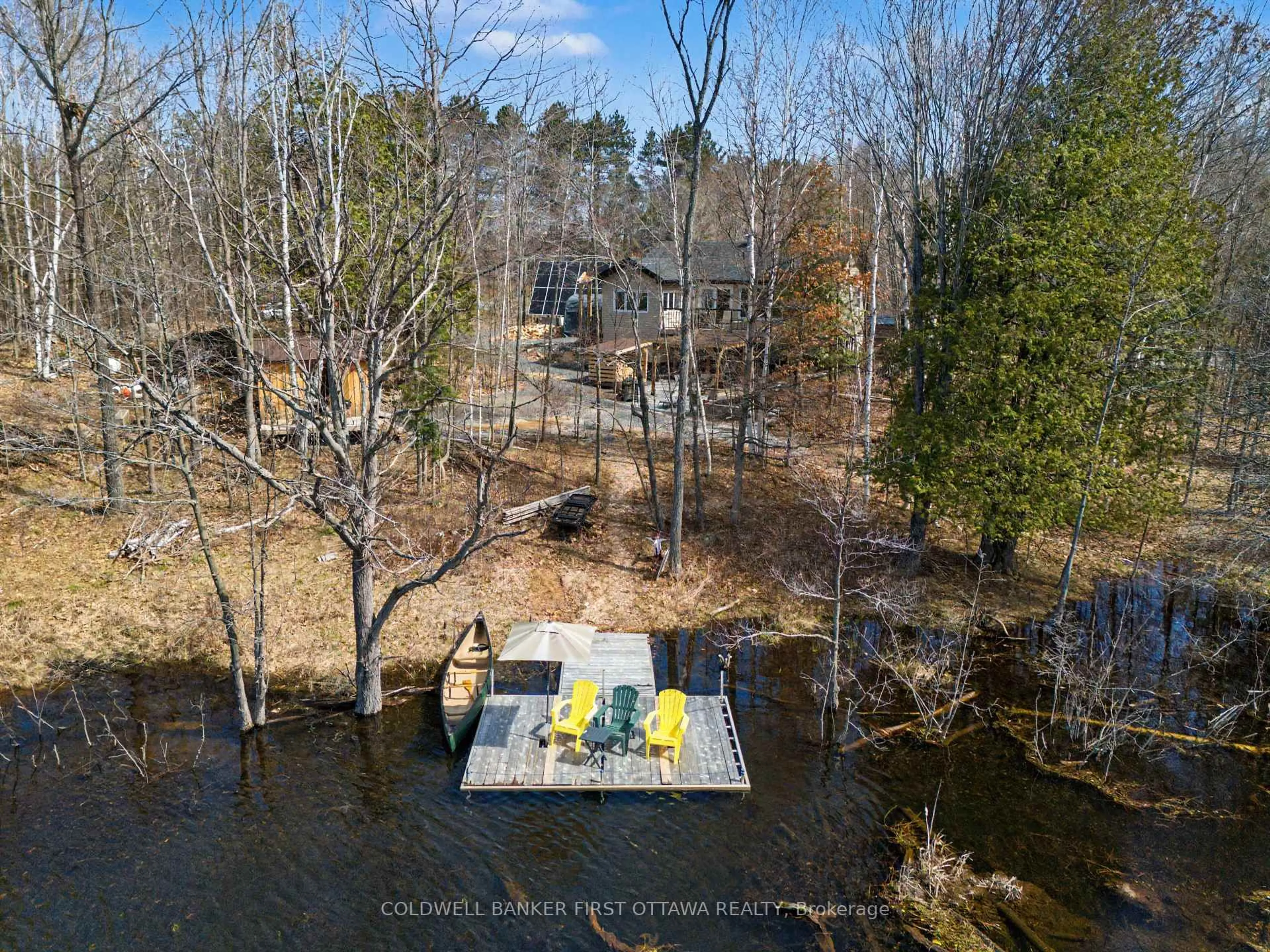 A pic from outside/outdoor area/front of a property/back of a property/a pic from drone, water/lake/river/ocean view for 4031 Bolingbroke Rd, Maberly Ontario K0H 2B0