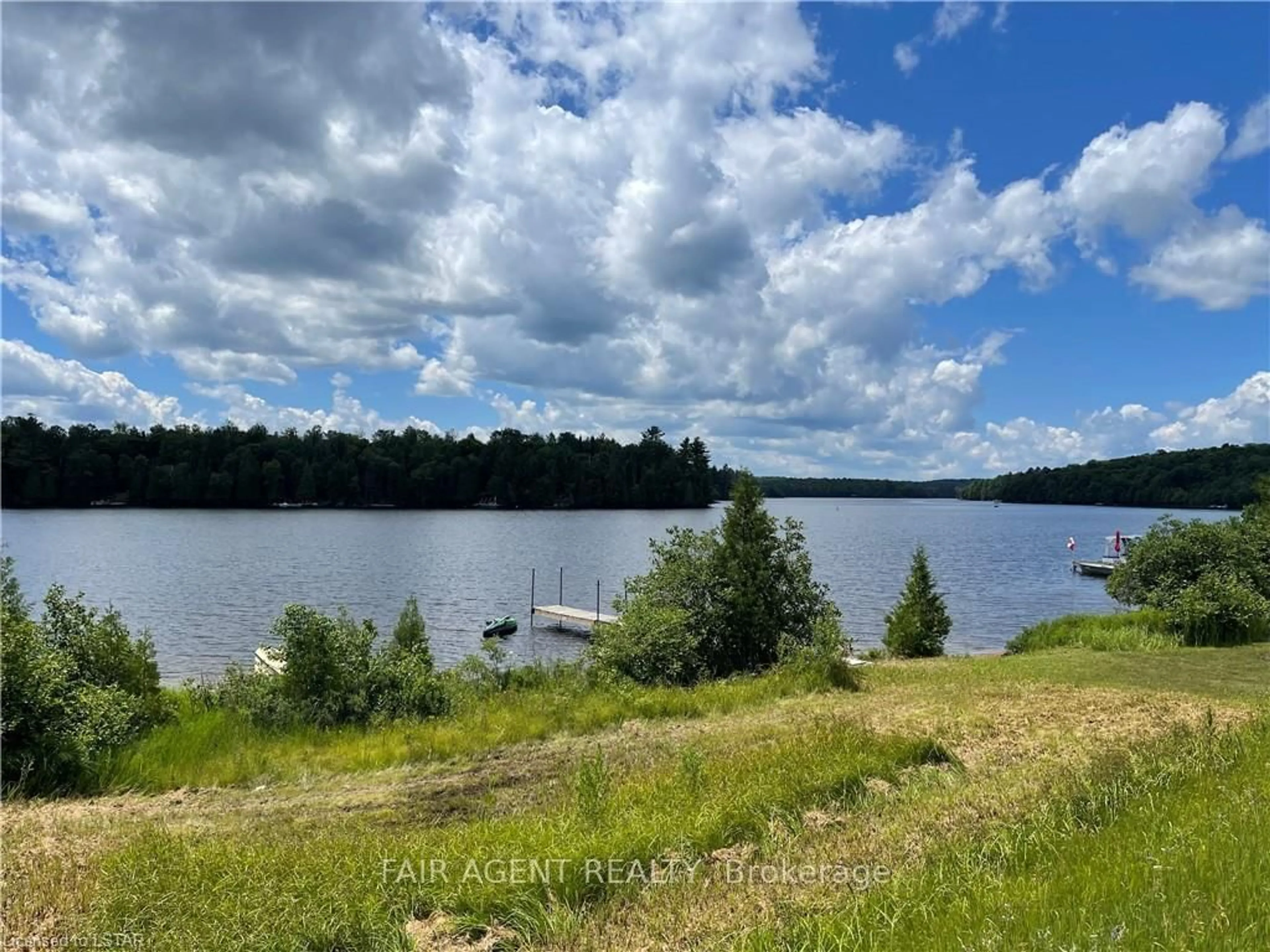 A pic from outside/outdoor area/front of a property/back of a property/a pic from drone, water/lake/river/ocean view for 2442 HIGHWAY 520, Magnetawan Ontario P0A 1C0