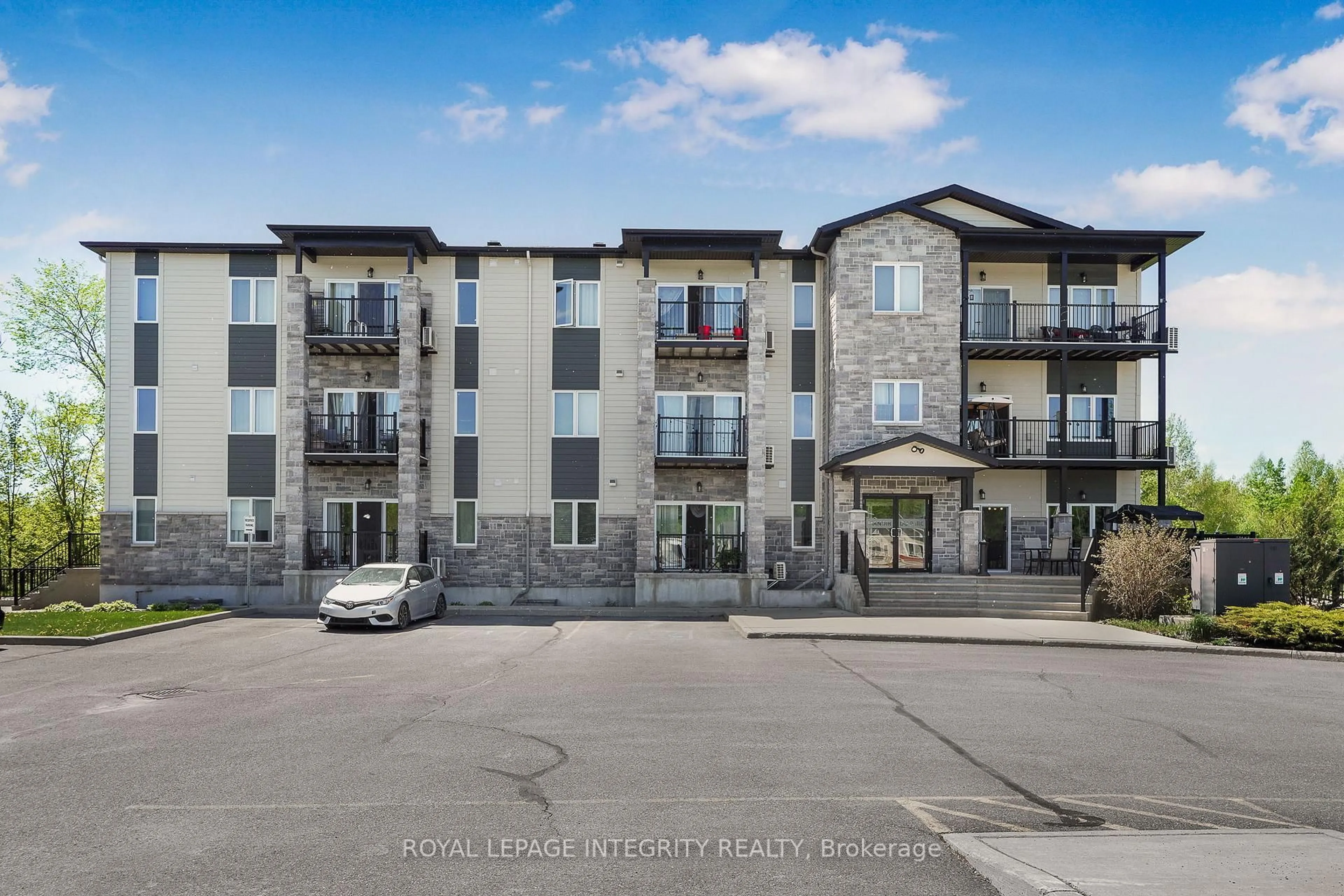 A pic from outside/outdoor area/front of a property/back of a property/a pic from drone, building for 48 Des Benevoles St #208, The Nation Ontario K0A 2M0