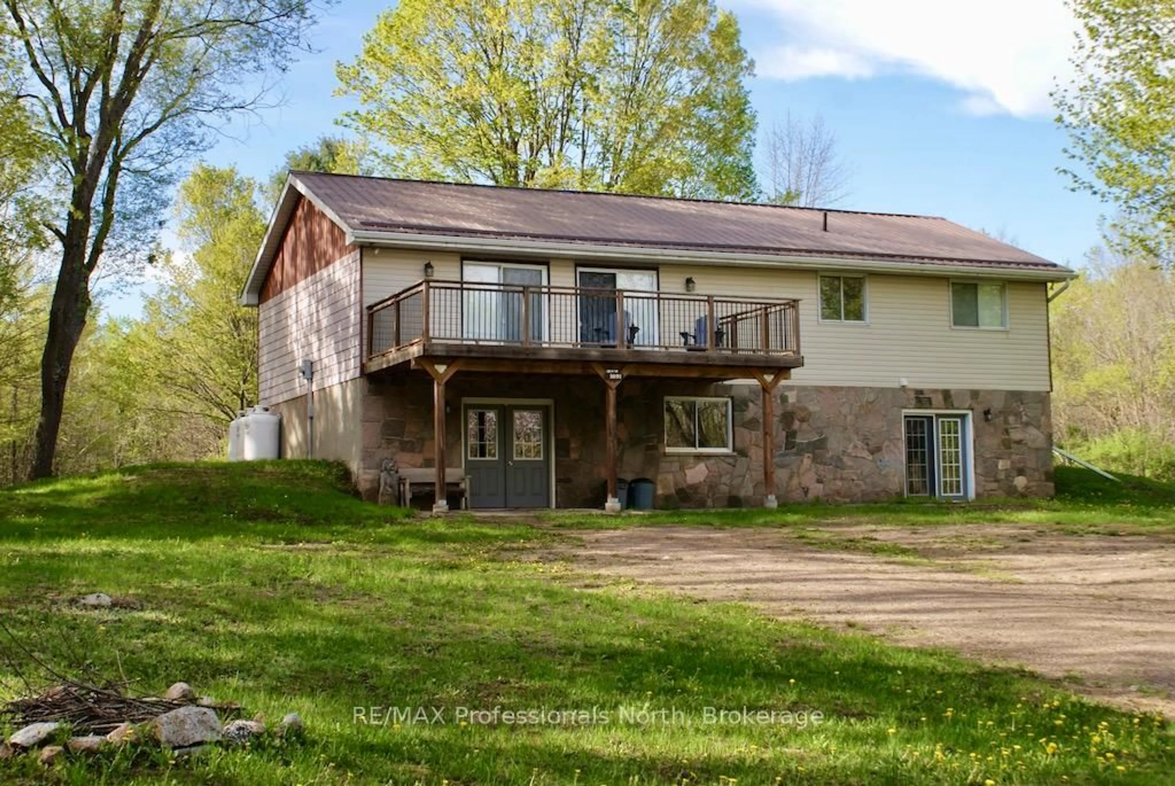 A pic from outside/outdoor area/front of a property/back of a property/a pic from drone, water/lake/river/ocean view for 1021 Touchwood Tr, Minden Hills Ontario K0M 2K0