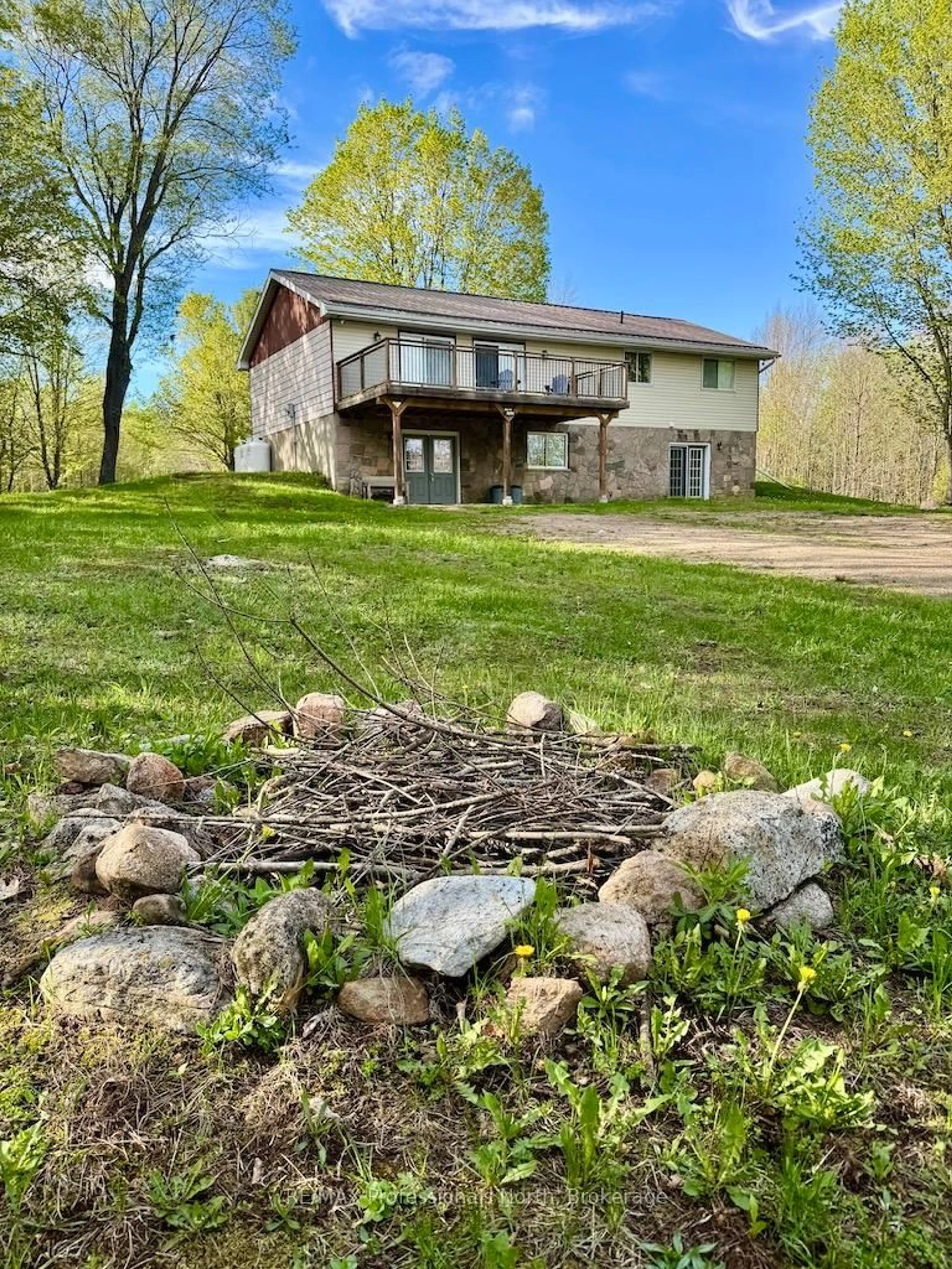 A pic from outside/outdoor area/front of a property/back of a property/a pic from drone, water/lake/river/ocean view for 1021 Touchwood Tr, Minden Hills Ontario K0M 2K0