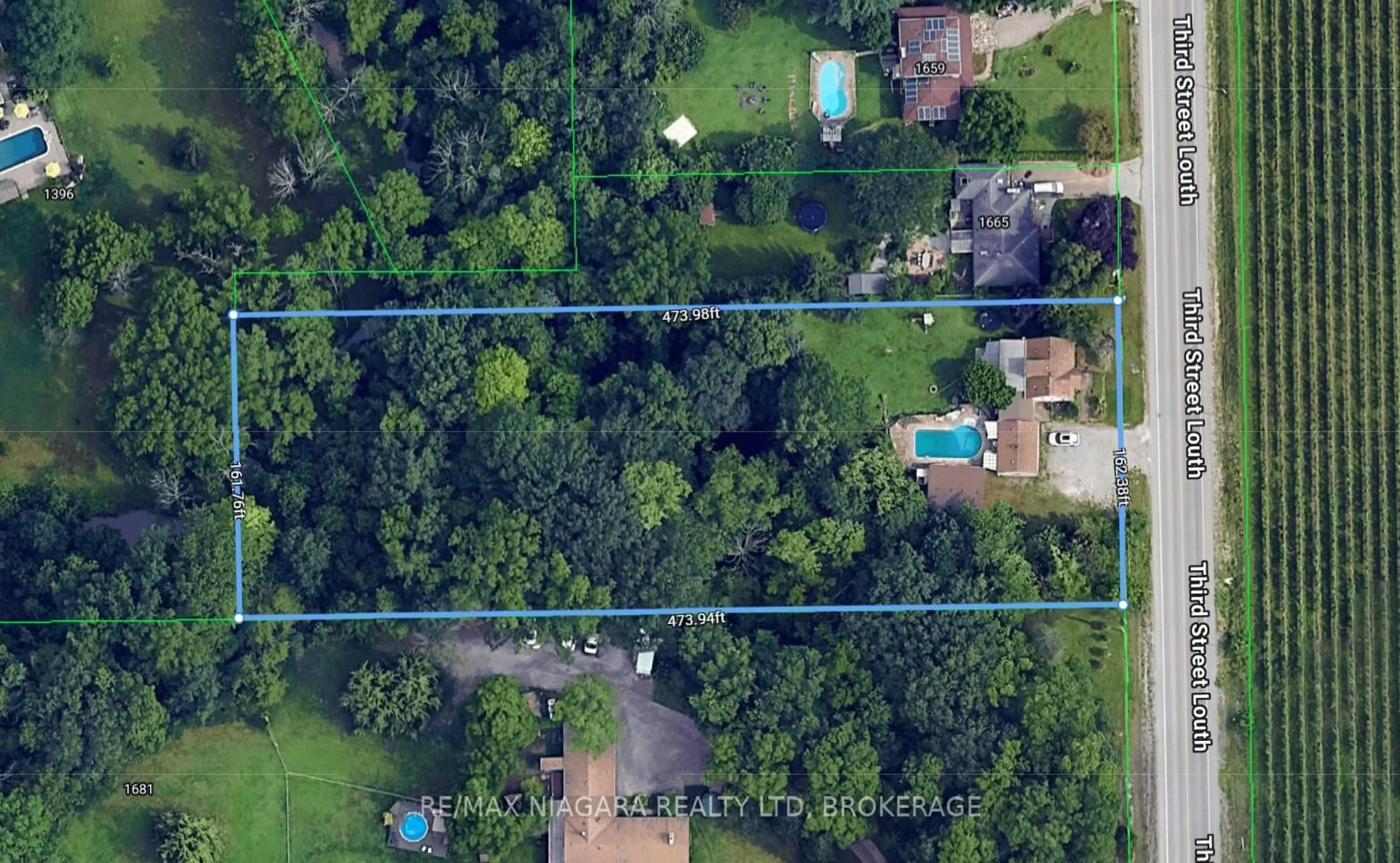 A pic from outside/outdoor area/front of a property/back of a property/a pic from drone, forest/trees view for 1671 Third Street Louth St, St. Catharines Ontario L2R 6P9