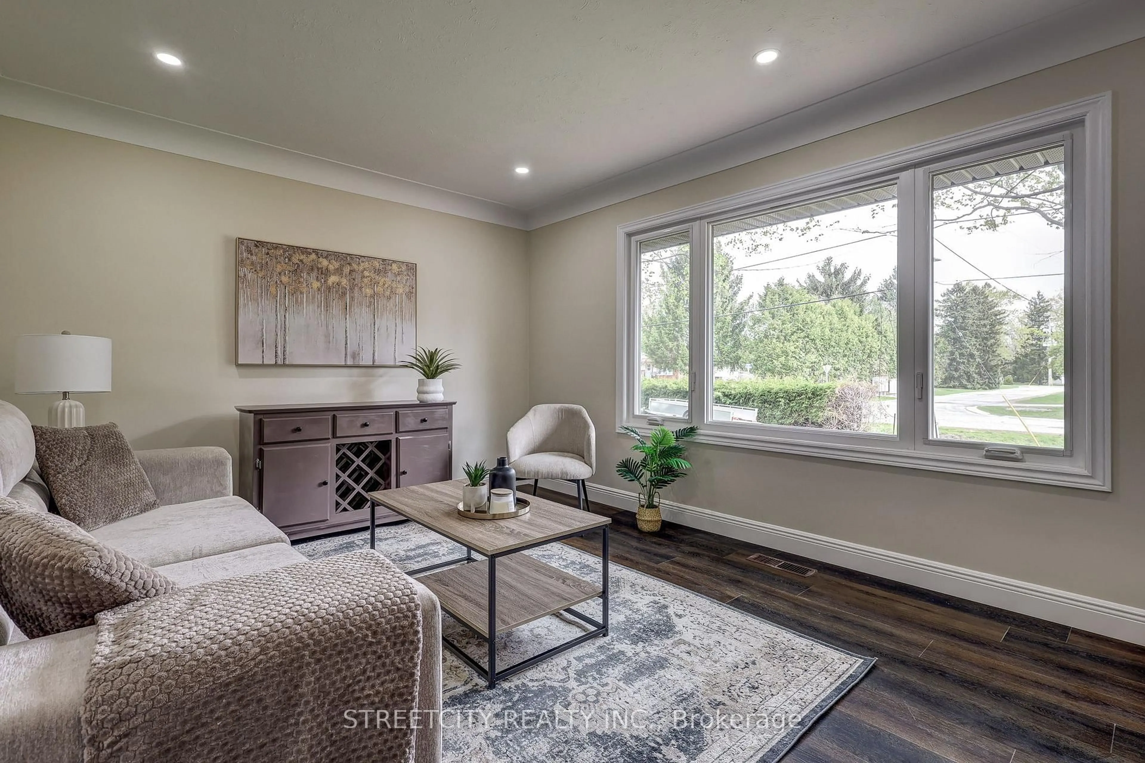 Living room with furniture, wood/laminate floor for 10 Vineden Dr, Central Elgin Ontario N5P 2M6