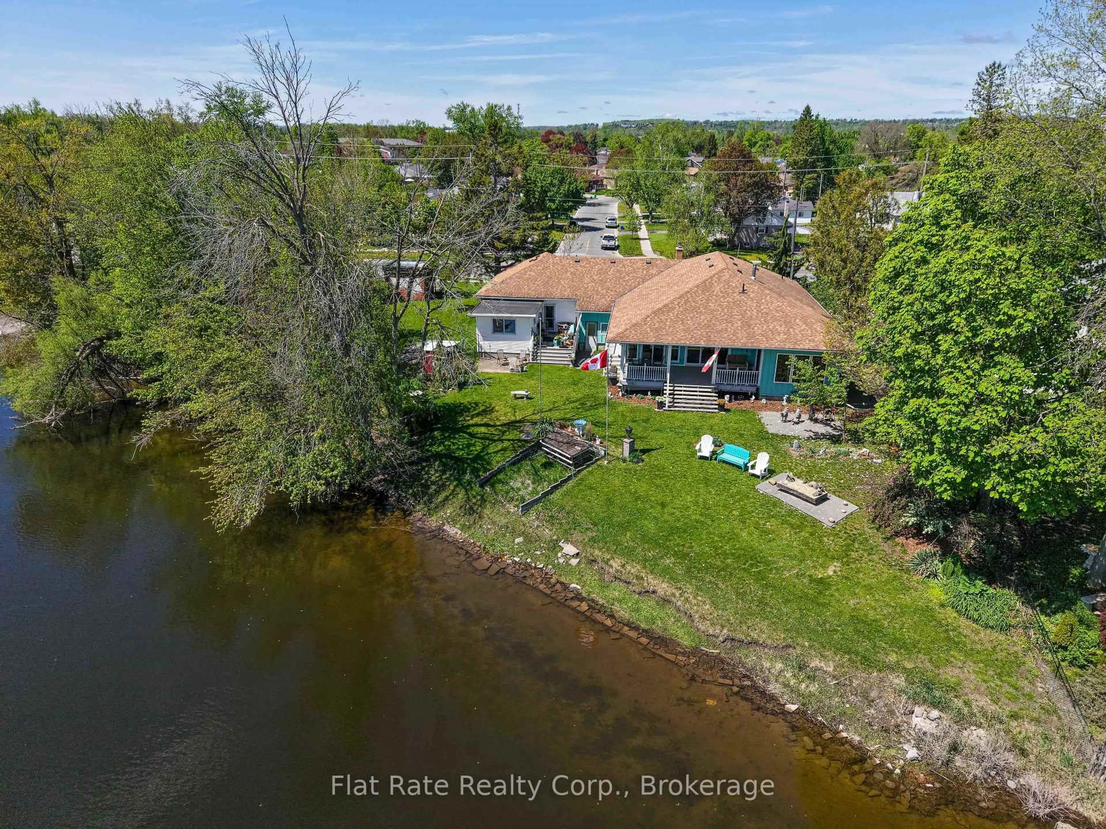 A pic from outside/outdoor area/front of a property/back of a property/a pic from drone, water/lake/river/ocean view for 510 Monaghan Rd, Peterborough Ontario K9J 5H5