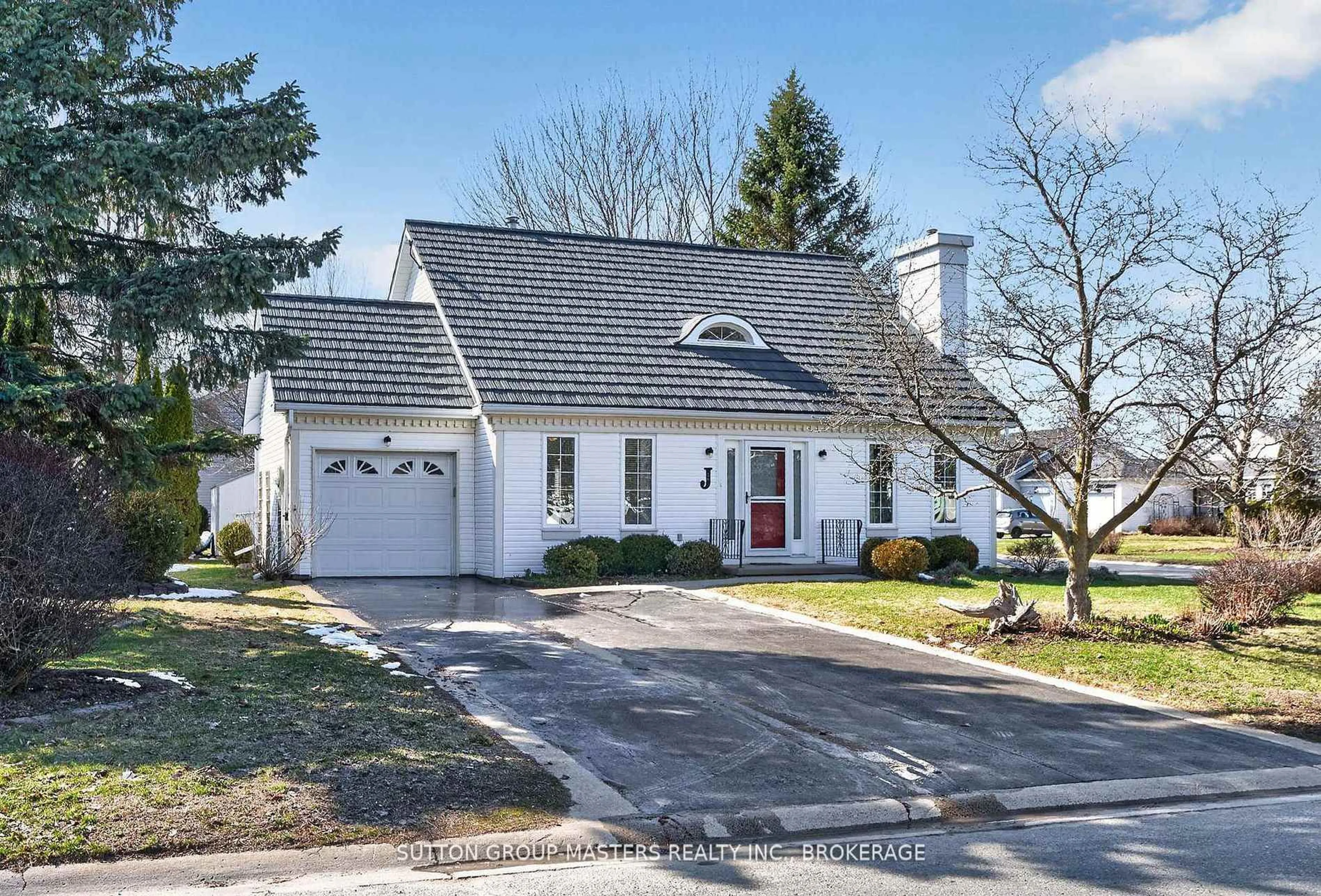 Home with vinyl exterior material, street for 16 Country Club Dr, Bath Ontario K0H 1G0