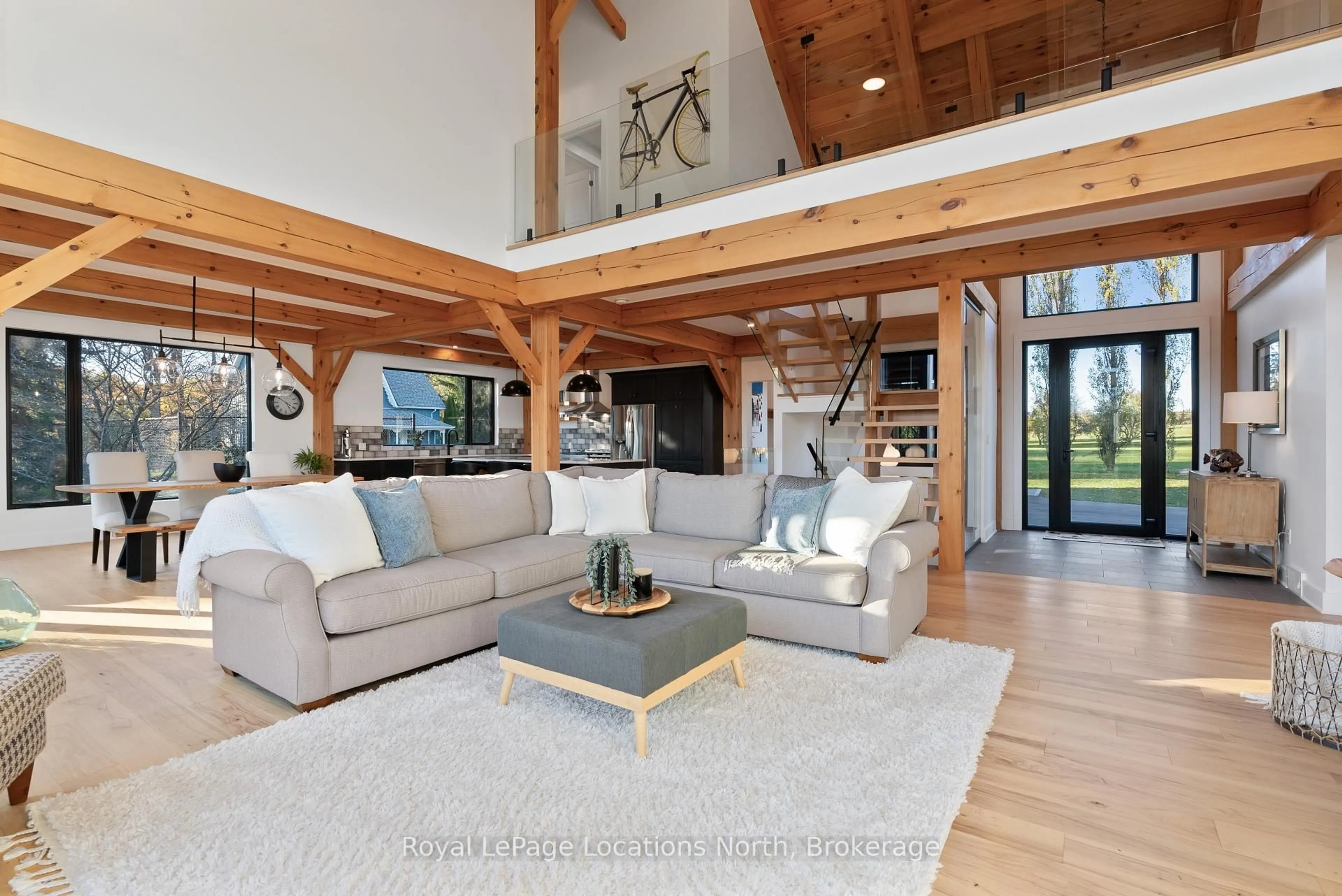 Living room with furniture, wood/laminate floor for 113 Slabtown Rd, Blue Mountains Ontario N0H 1J0