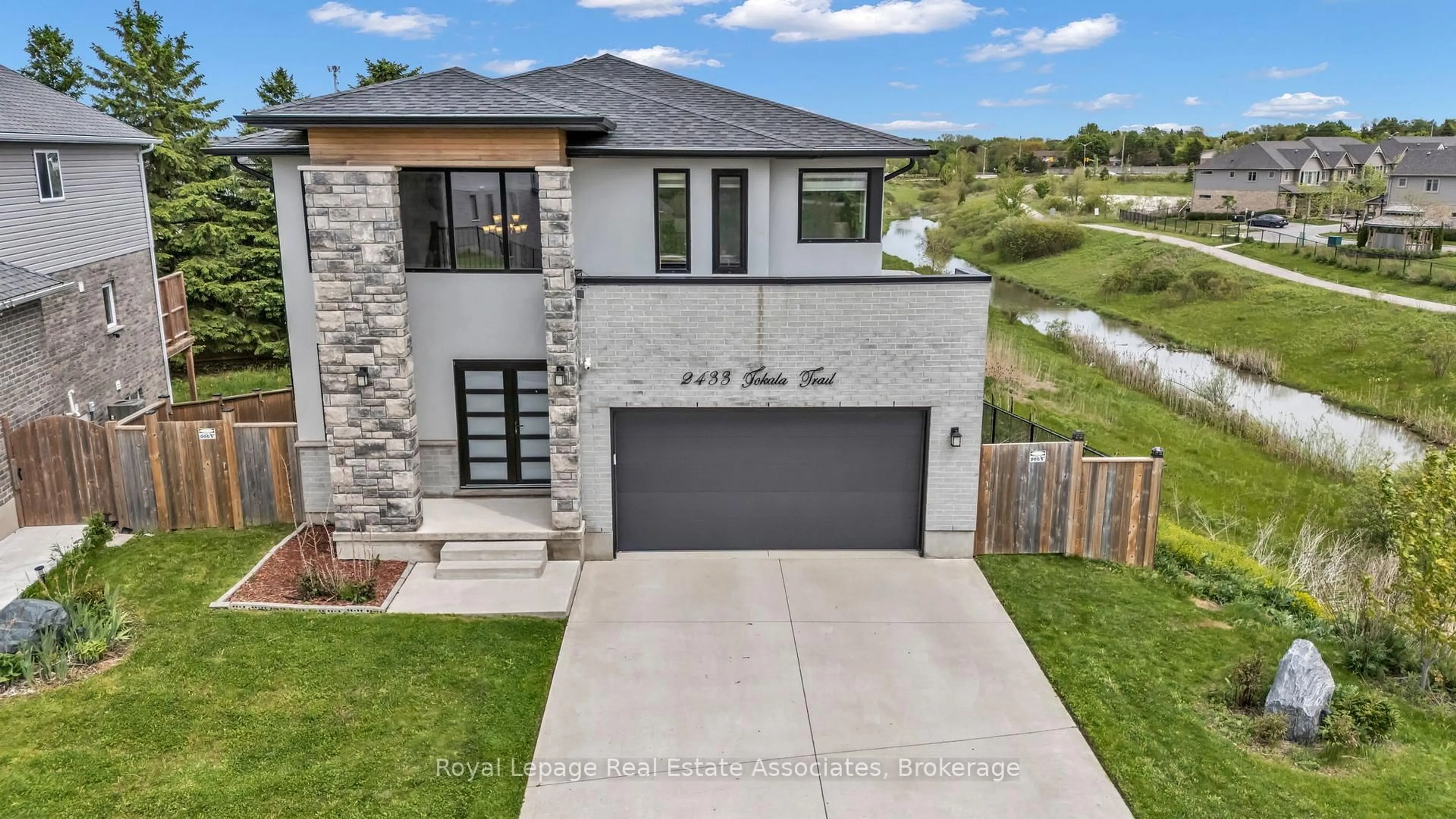 Home with brick exterior material, street for 2433 Tokala Tr, London North Ontario N6G 0V6