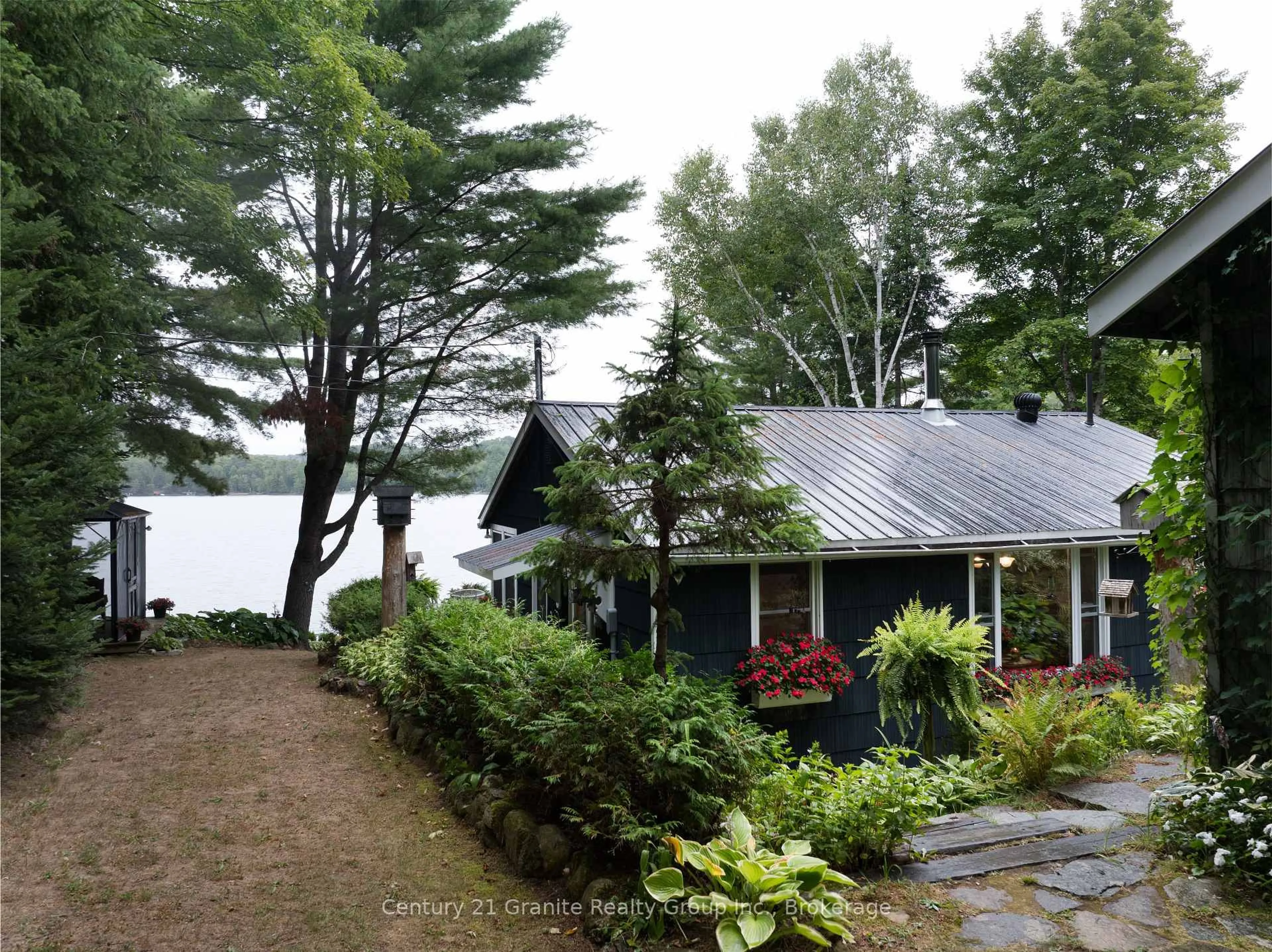 A pic from outside/outdoor area/front of a property/back of a property/a pic from drone, water/lake/river/ocean view for 1528 Dignan Rd, Dysart et al Ontario K0M 1S0