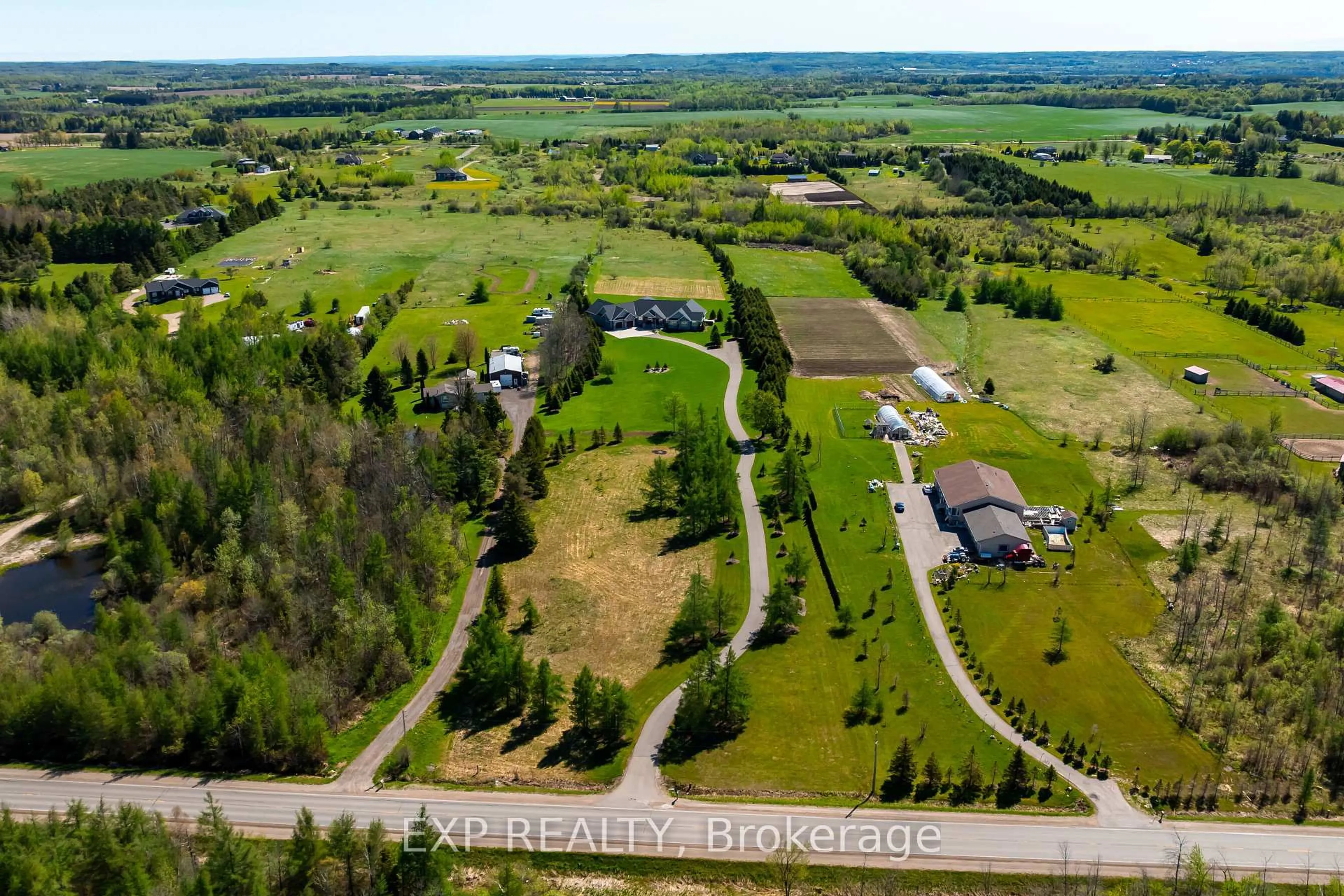 A pic from outside/outdoor area/front of a property/back of a property/a pic from drone, water/lake/river/ocean view for 473449 County Rd 11, Amaranth Ontario L9W 0R3