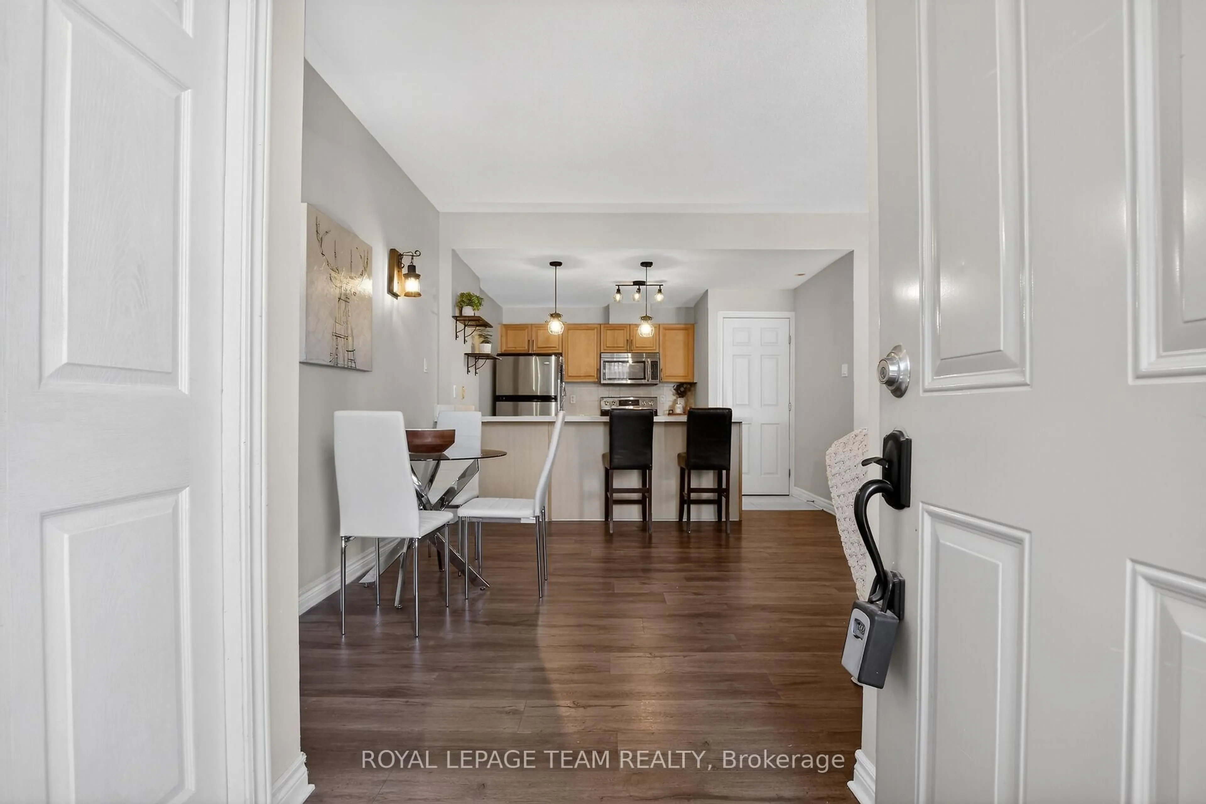 Open concept kitchen, wood/laminate floor for 165 Crestway Dr #D, Ottawa Ontario K2G 7C8