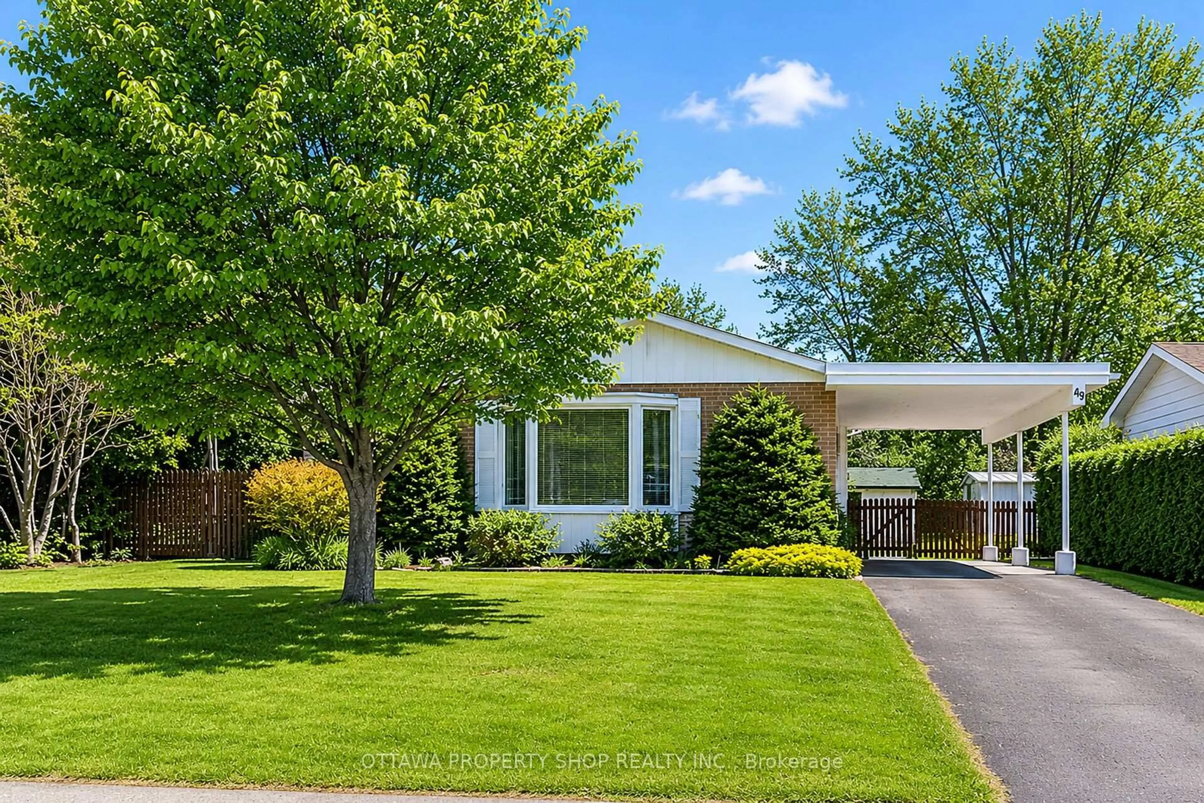 Home with vinyl exterior material, street for 49 Country Lane, Ottawa Ontario K2L 1H9