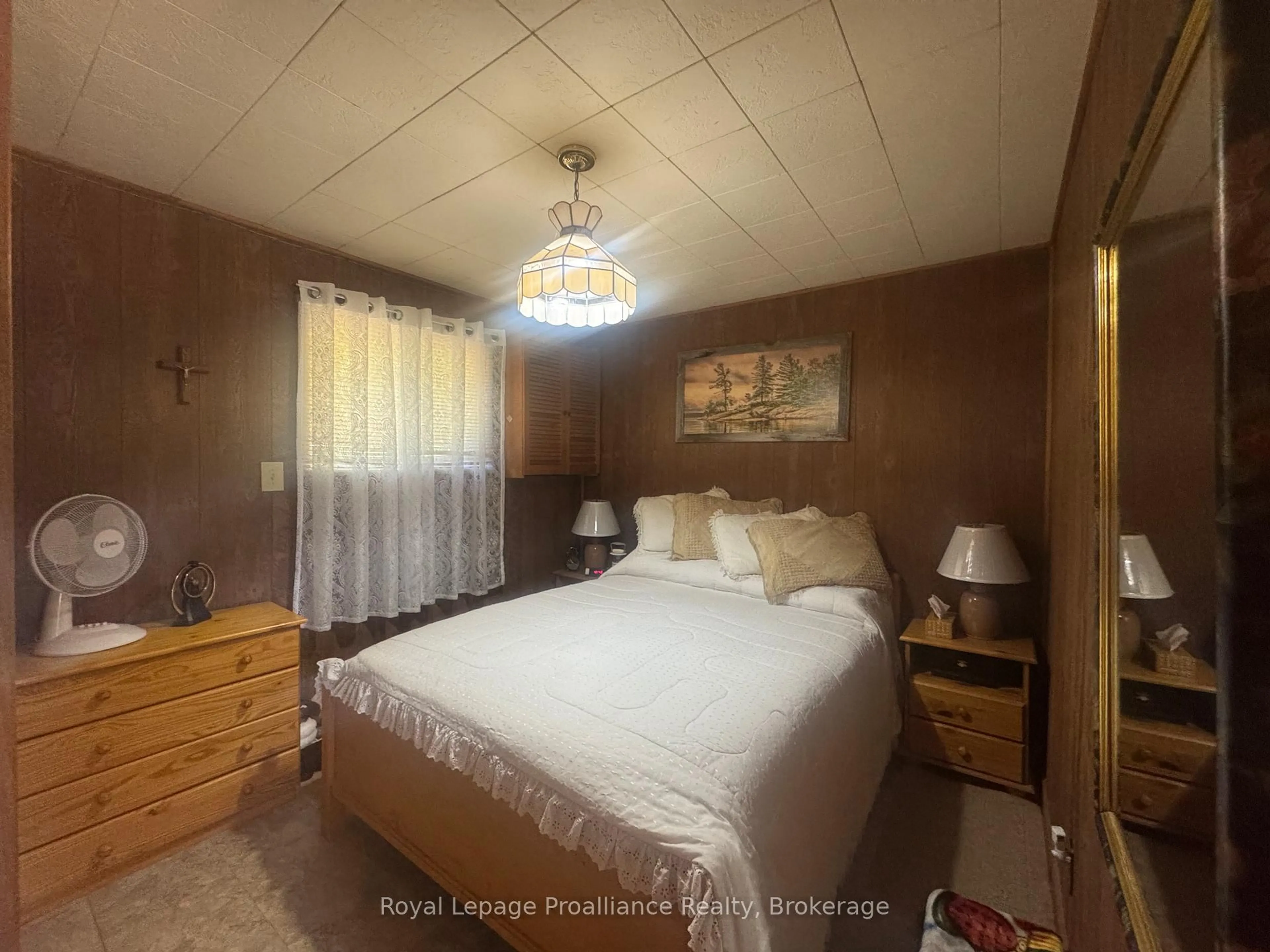Bedroom with bed, wood/laminate floor for 920 Beaver Creek Rd, Limoges Ontario K0K 2M0