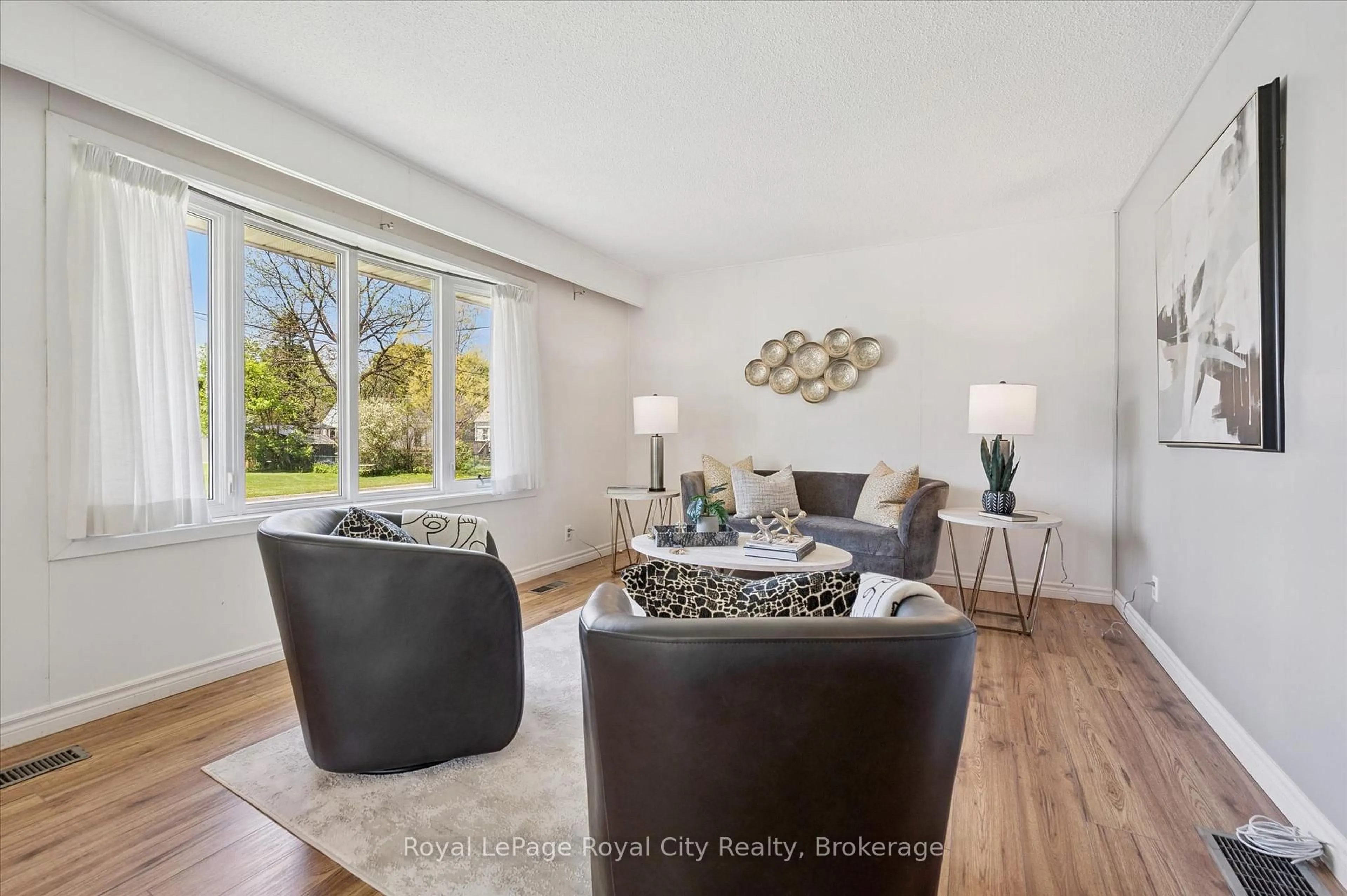 Living room with furniture, wood/laminate floor for 22 Churchill Cres, Centre Wellington Ontario N1M 2J3