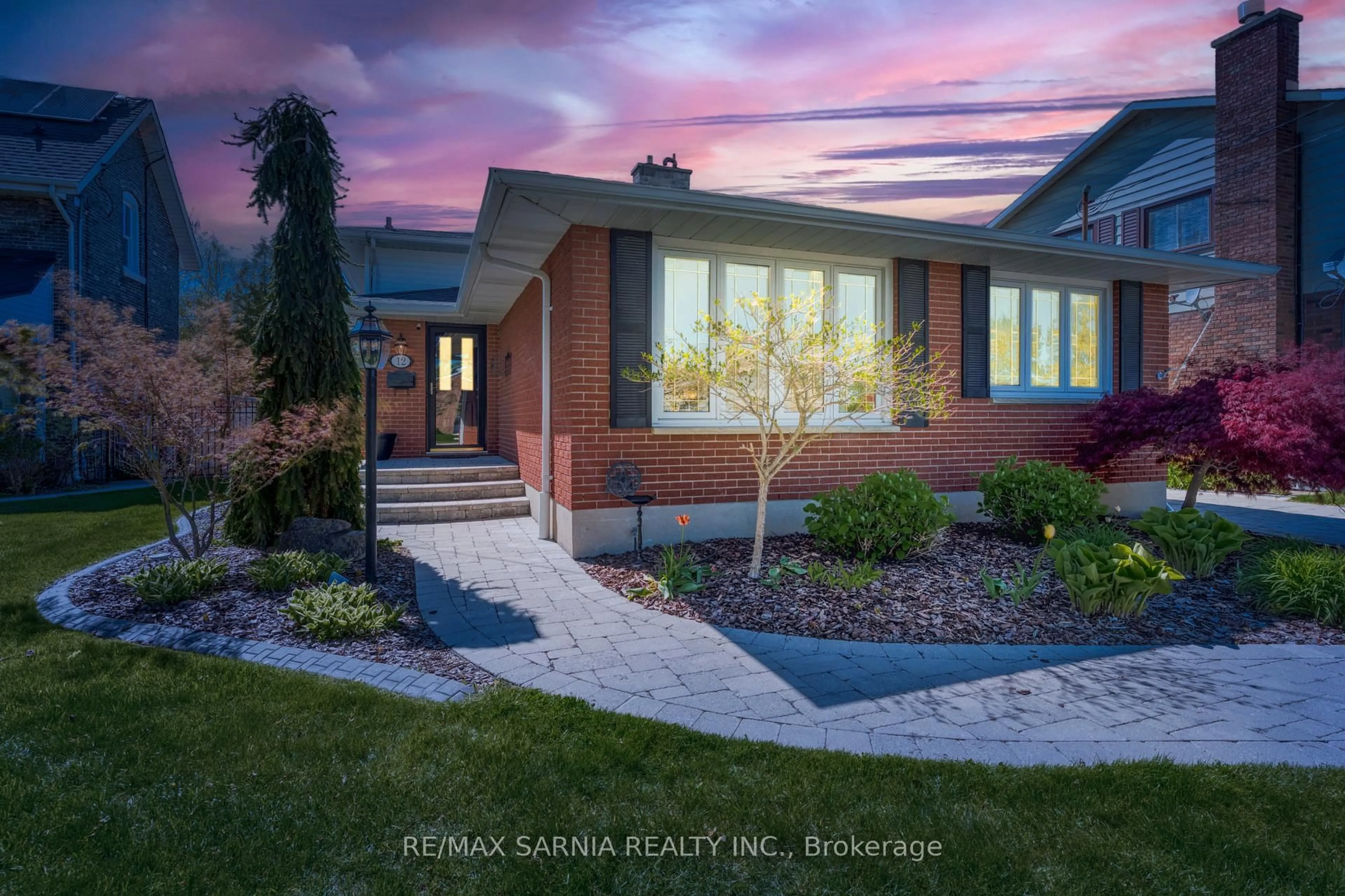 Home with brick exterior material, street for 12 Fort St, Point Edward Ontario N7V 1M2