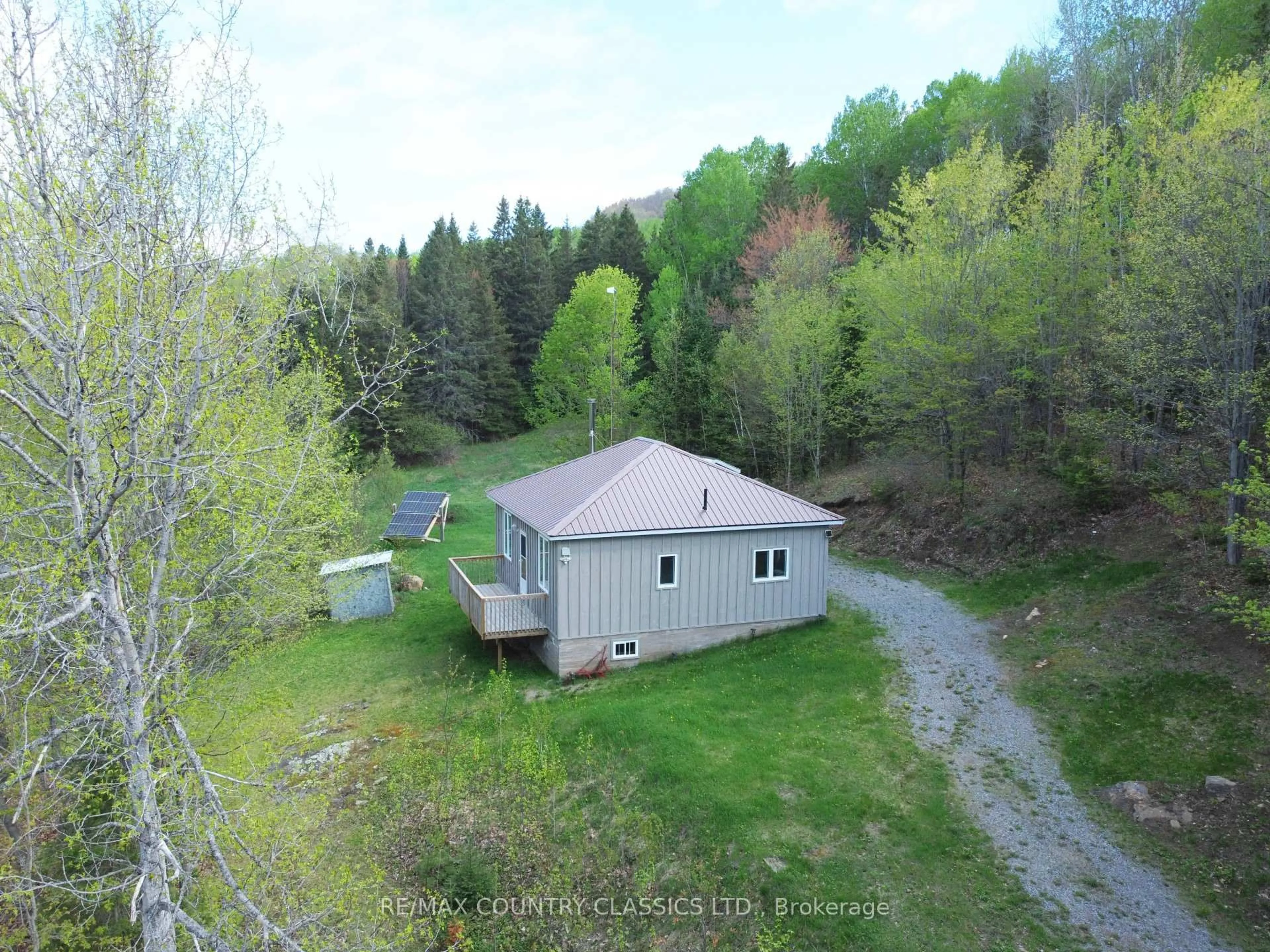 A pic from outside/outdoor area/front of a property/back of a property/a pic from drone, unknown for 117 Craigmont Rd, Combermere Ontario K0J 1L0