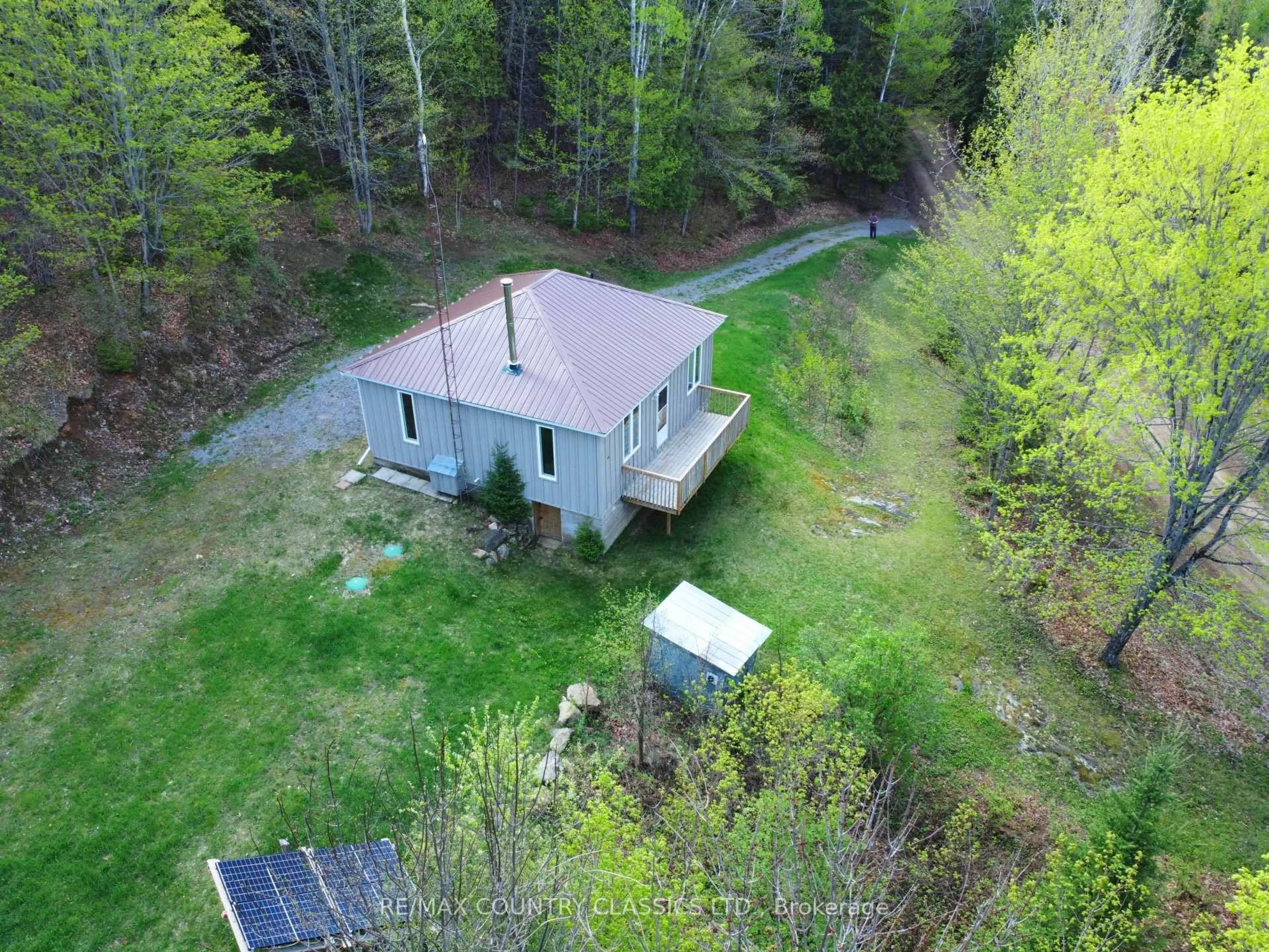 A pic from outside/outdoor area/front of a property/back of a property/a pic from drone, forest/trees view for 117 Craigmont Rd, Combermere Ontario K0J 1L0