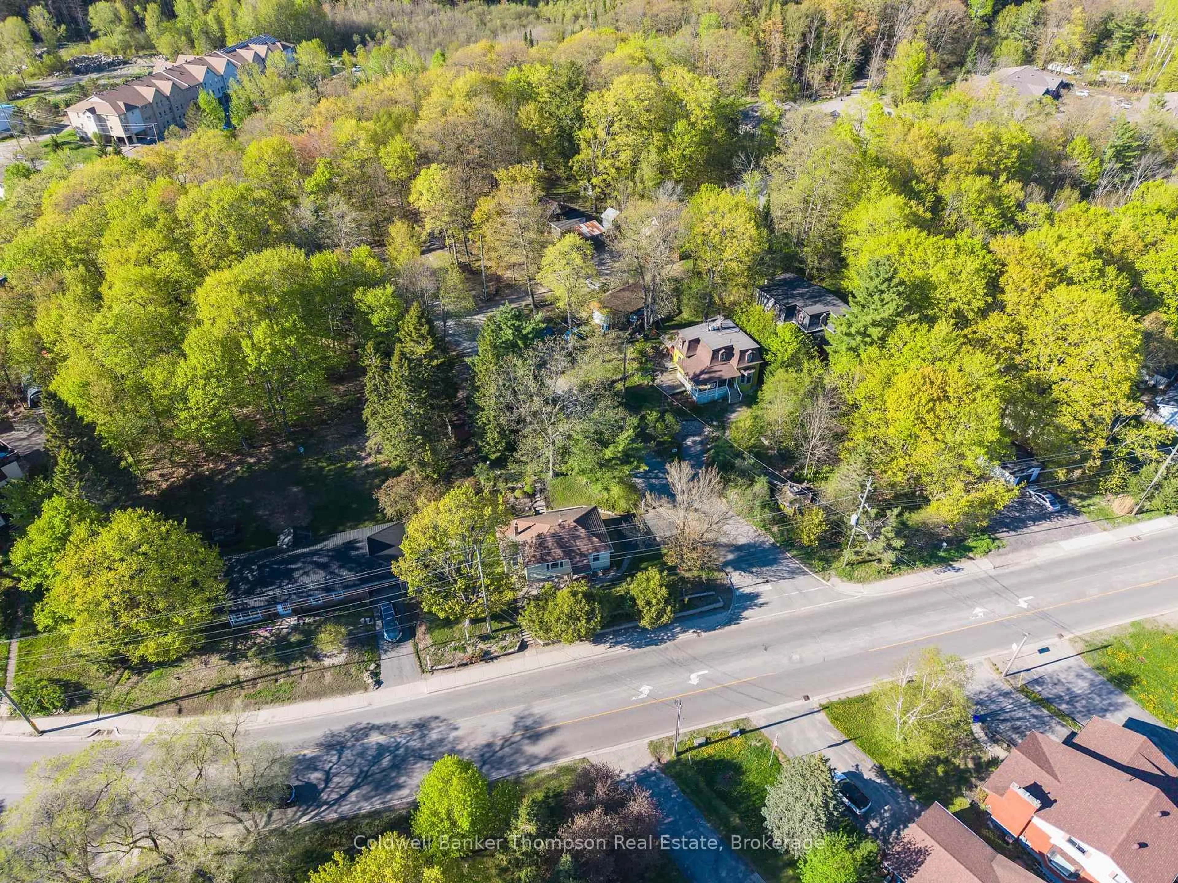 A pic from outside/outdoor area/front of a property/back of a property/a pic from drone, street for 16 West Rd, Huntsville Ontario P1H 1L2