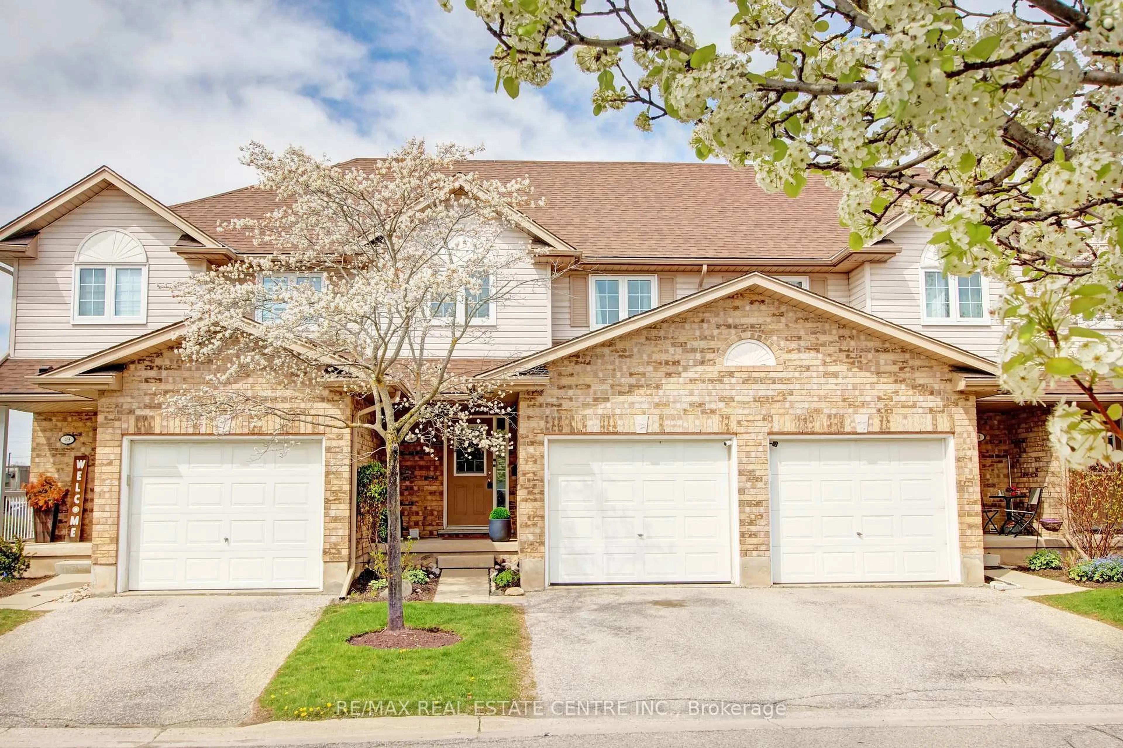 Home with brick exterior material, street for 31 Schroder Cres #50, Guelph Ontario N1E 7M6