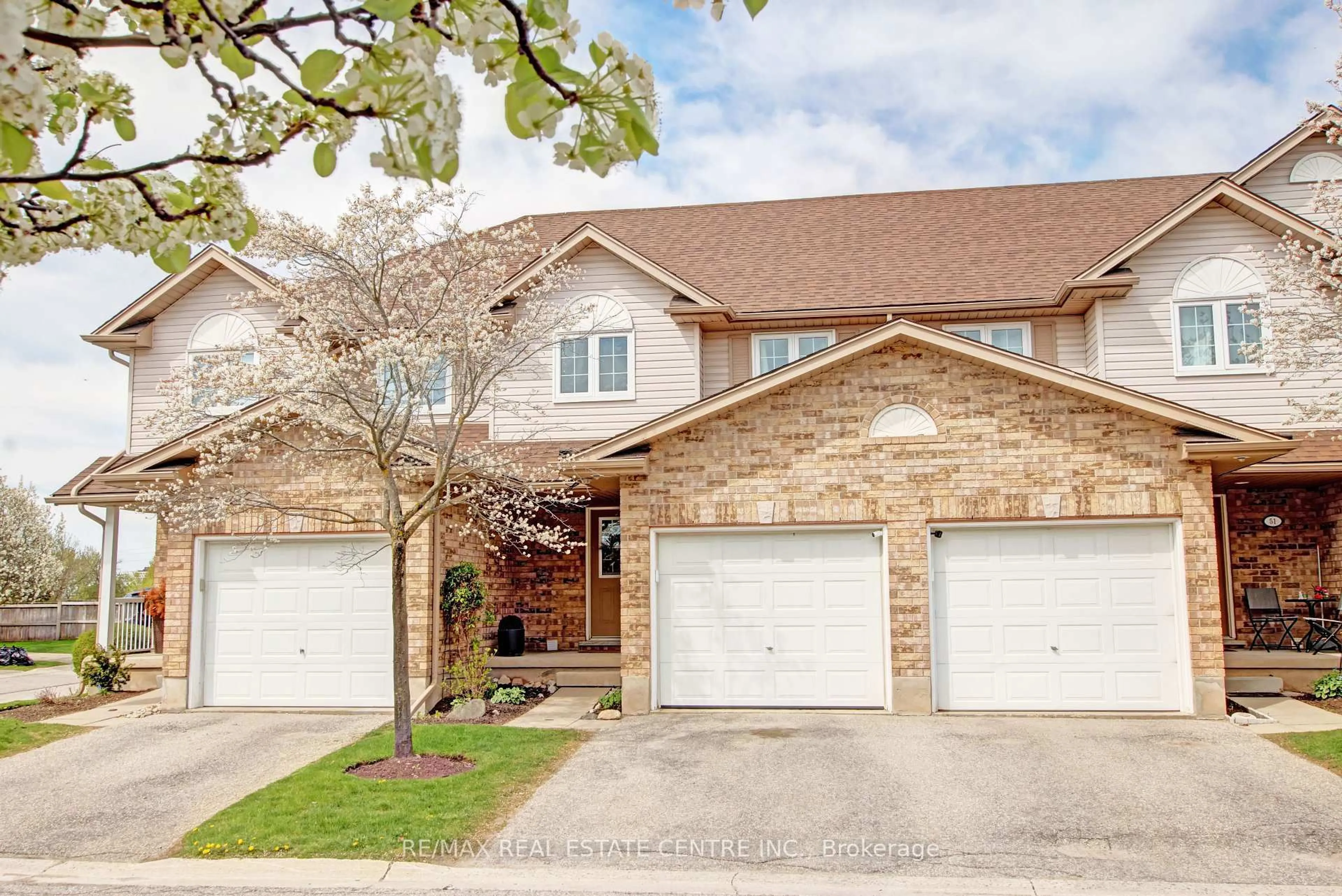 Home with brick exterior material, street for 31 Schroder Cres #50, Guelph Ontario N1E 7M6