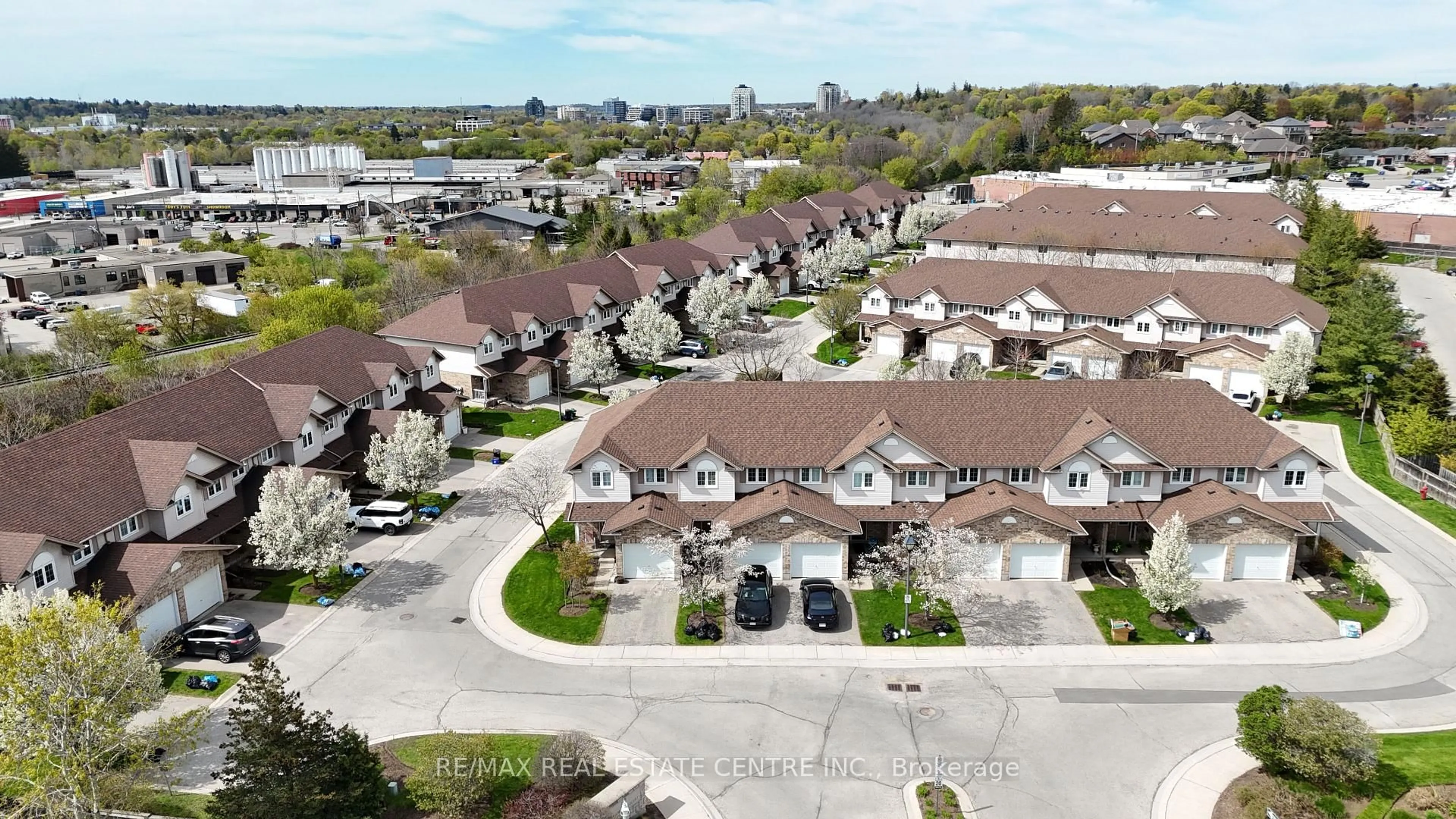A pic from outside/outdoor area/front of a property/back of a property/a pic from drone, street for 31 Schroder Cres #50, Guelph Ontario N1E 7M6