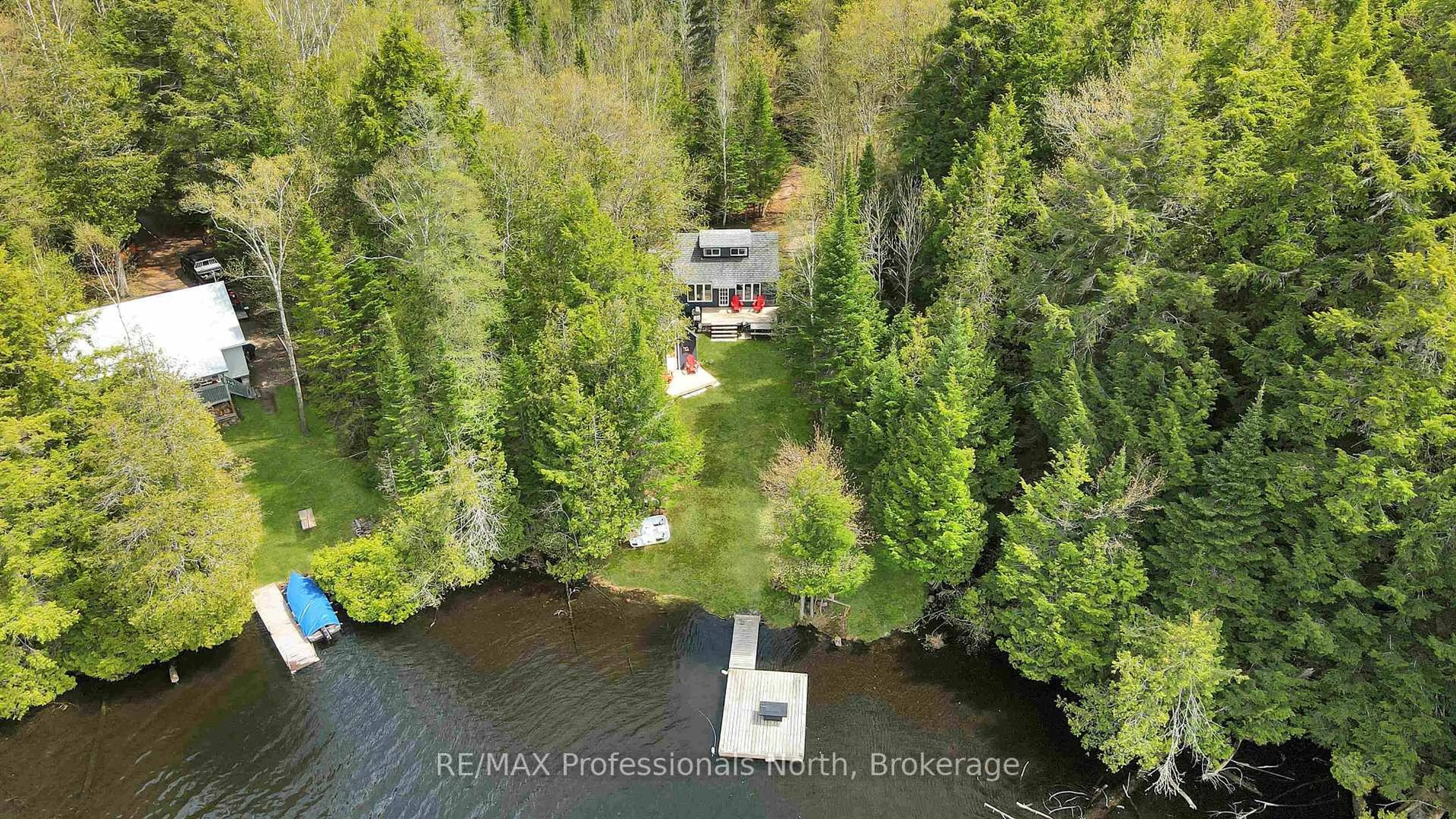A pic from outside/outdoor area/front of a property/back of a property/a pic from drone, water/lake/river/ocean view for 1514 Little Straggle Lake Dr, Dysart et al Ontario K0L 1M1