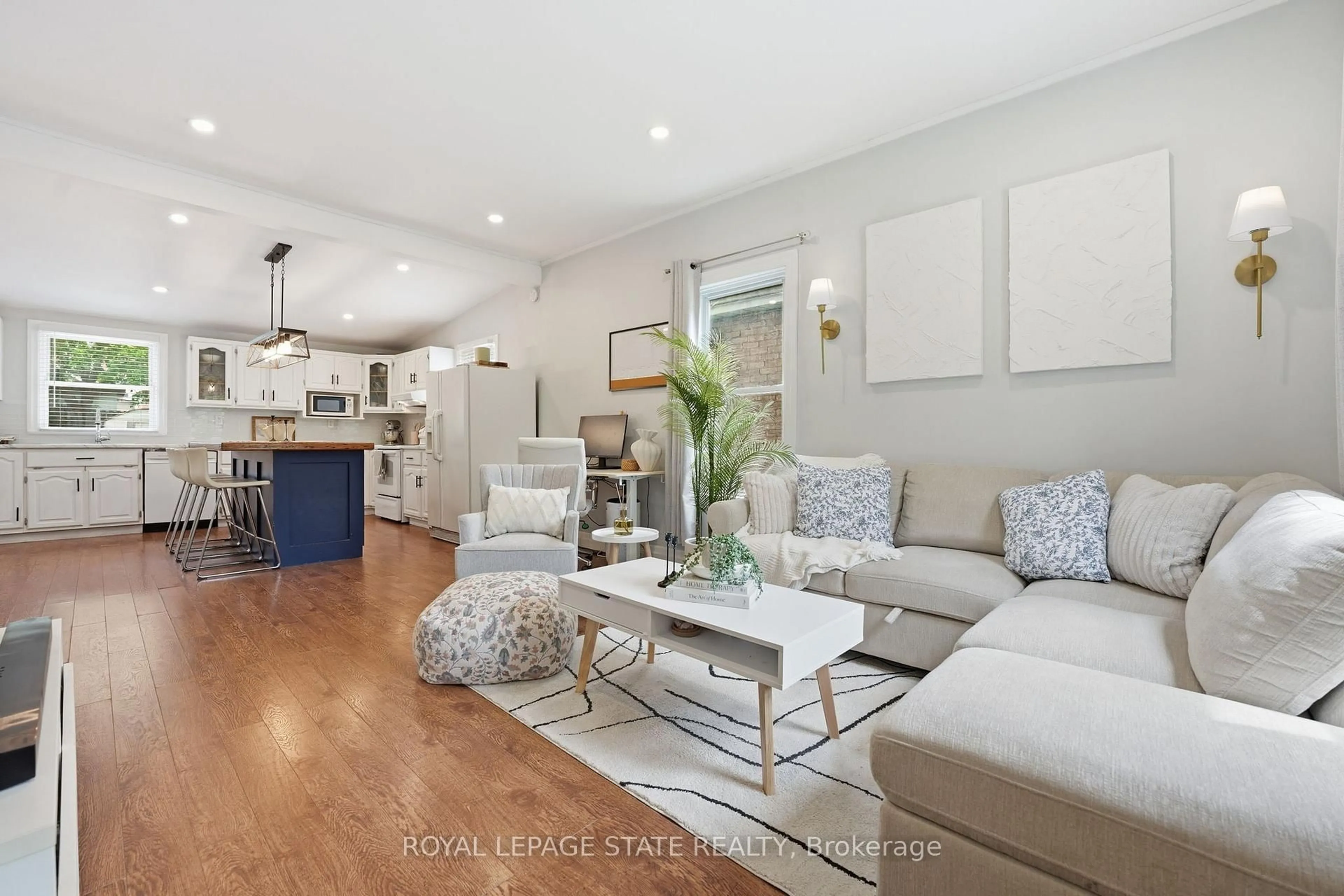 Living room with furniture, wood/laminate floor for 43 Alonzo St, Brantford Ontario N3R 1A1