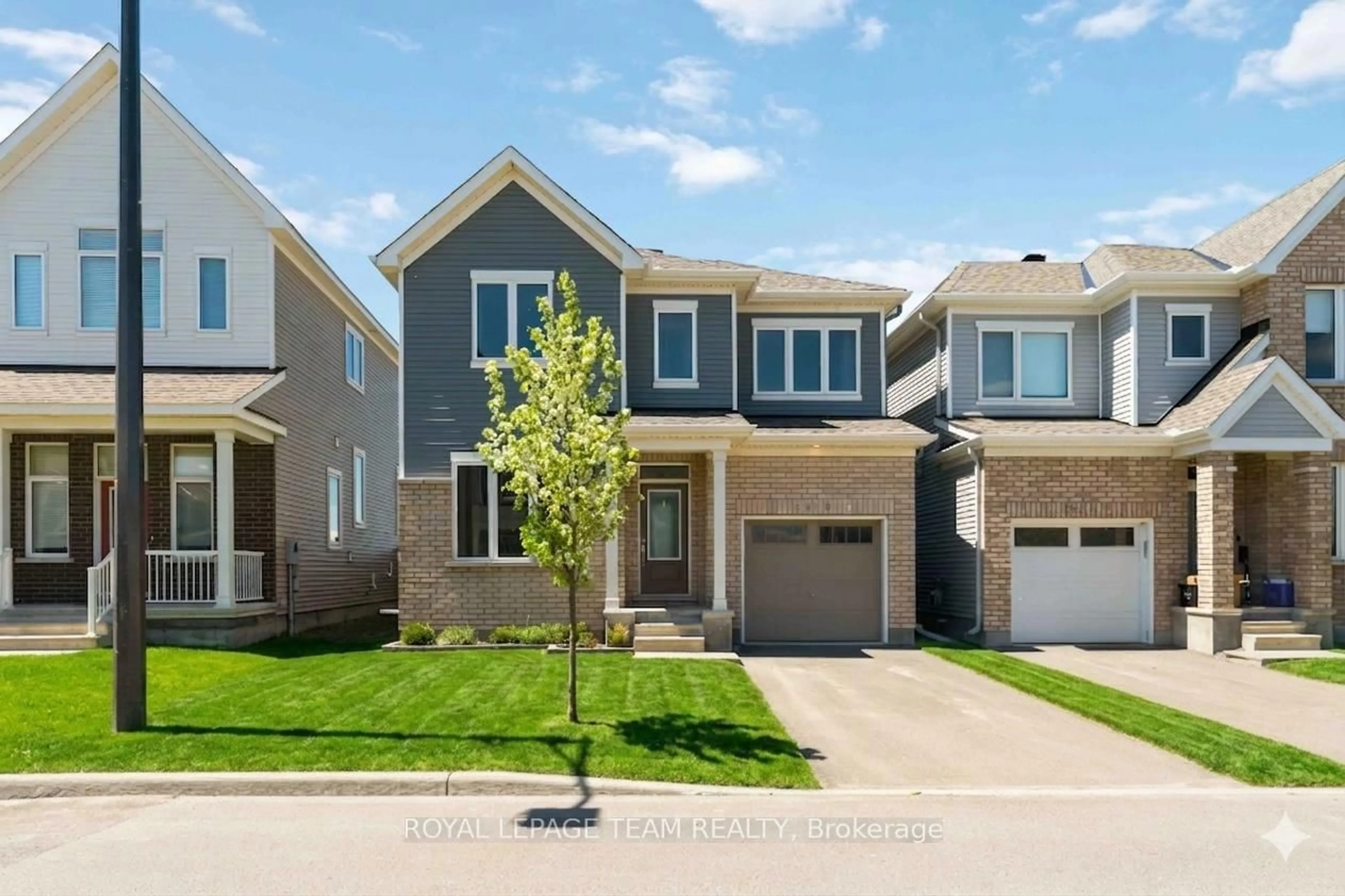 Home with brick exterior material, street for 3048 Travertine Way, Ottawa Ontario K2J 6W9