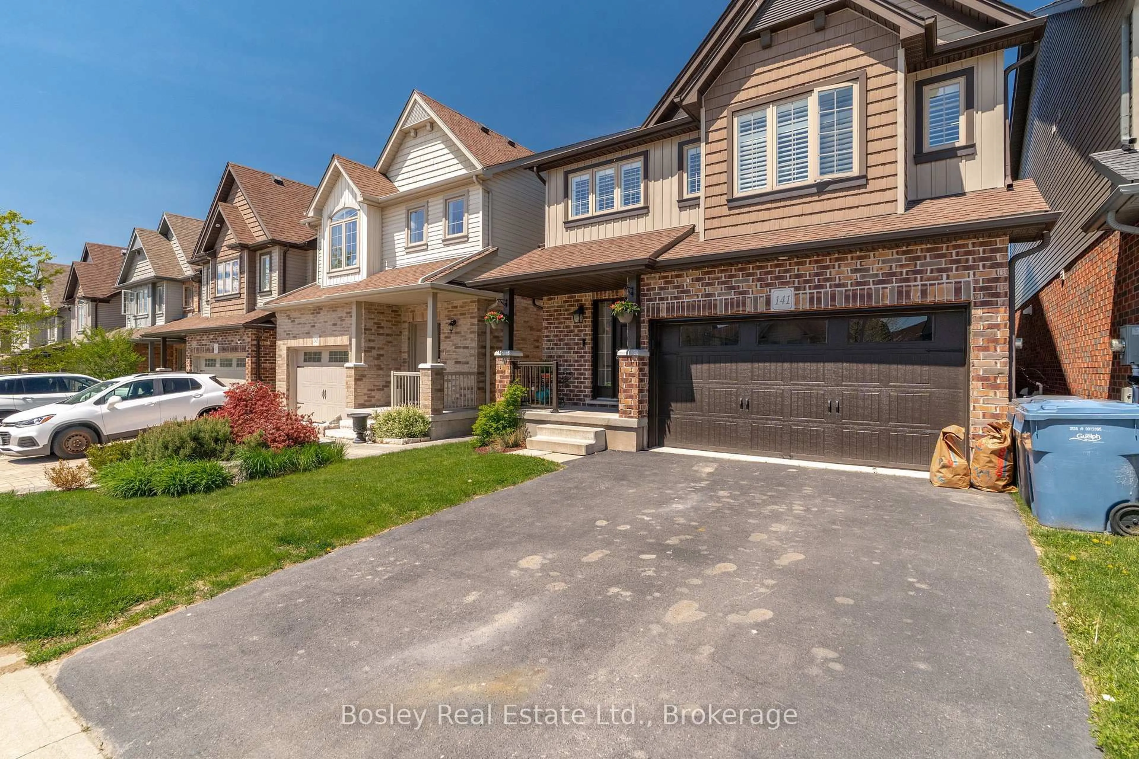 Home with brick exterior material, street for 141 Couling Cres, Guelph Ontario N1E 0L4