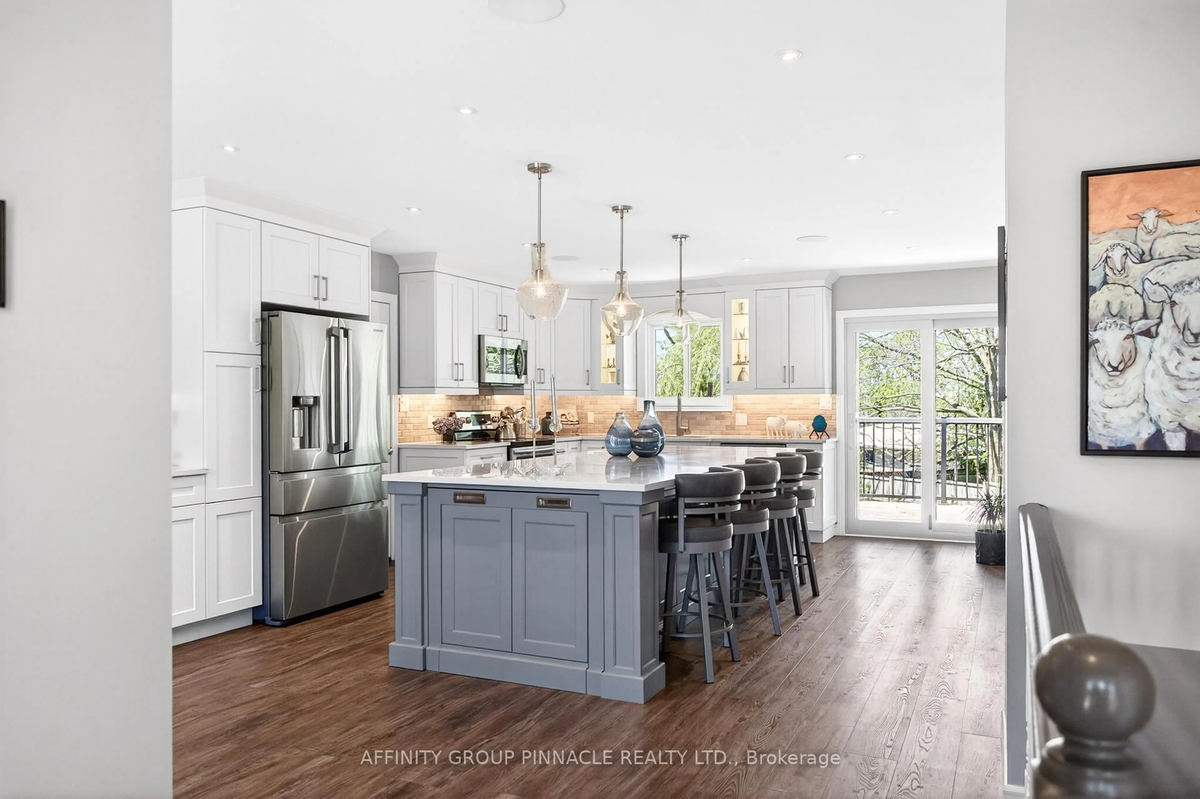 Open concept kitchen, wood/laminate floor for 9 O'Connell Crt, Kawartha Lakes Ontario K9V 5Y1