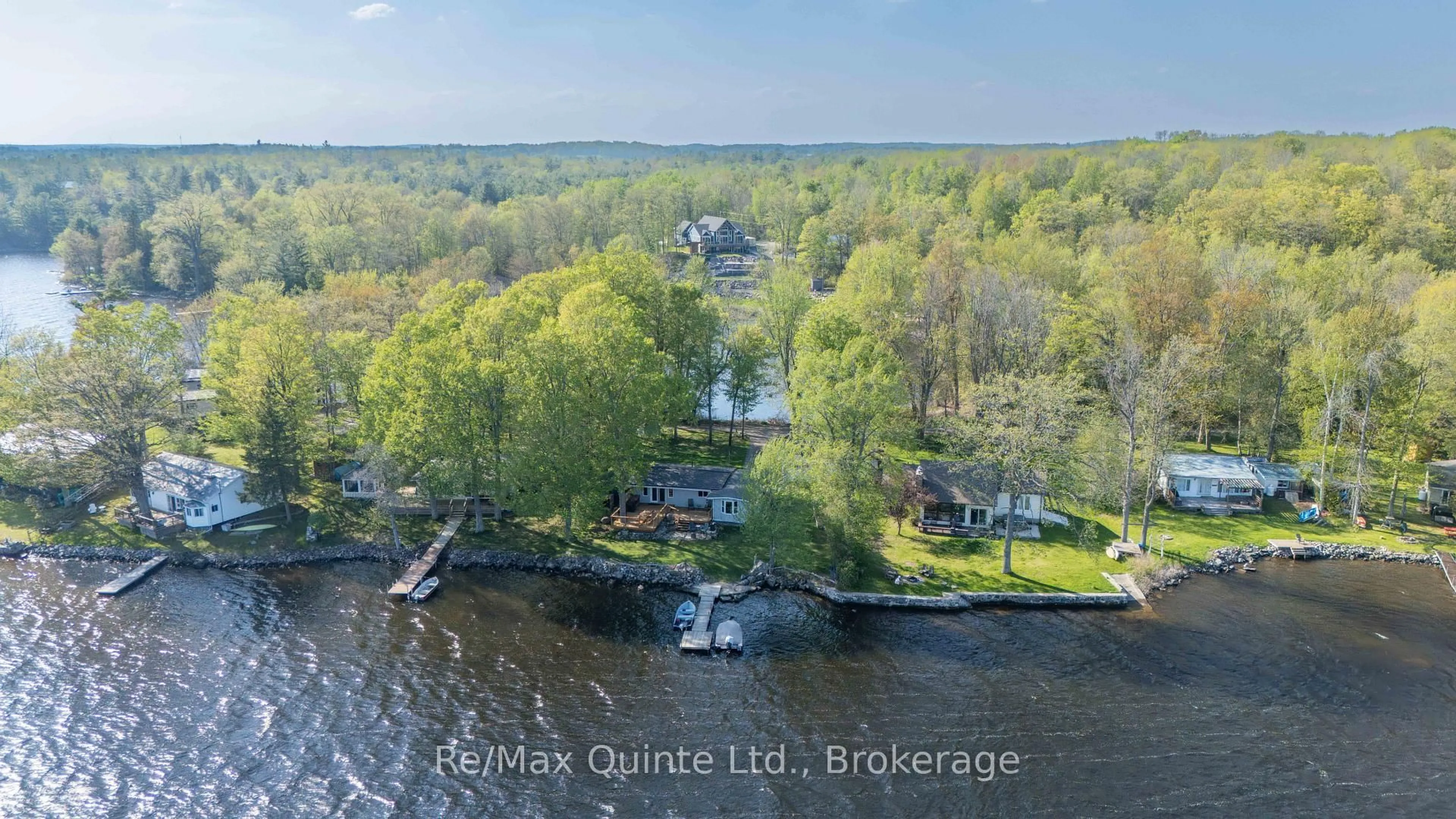 A pic from outside/outdoor area/front of a property/back of a property/a pic from drone, water/lake/river/ocean view for 585 Pine Point Lane, Madoc Ontario K0K 2K0