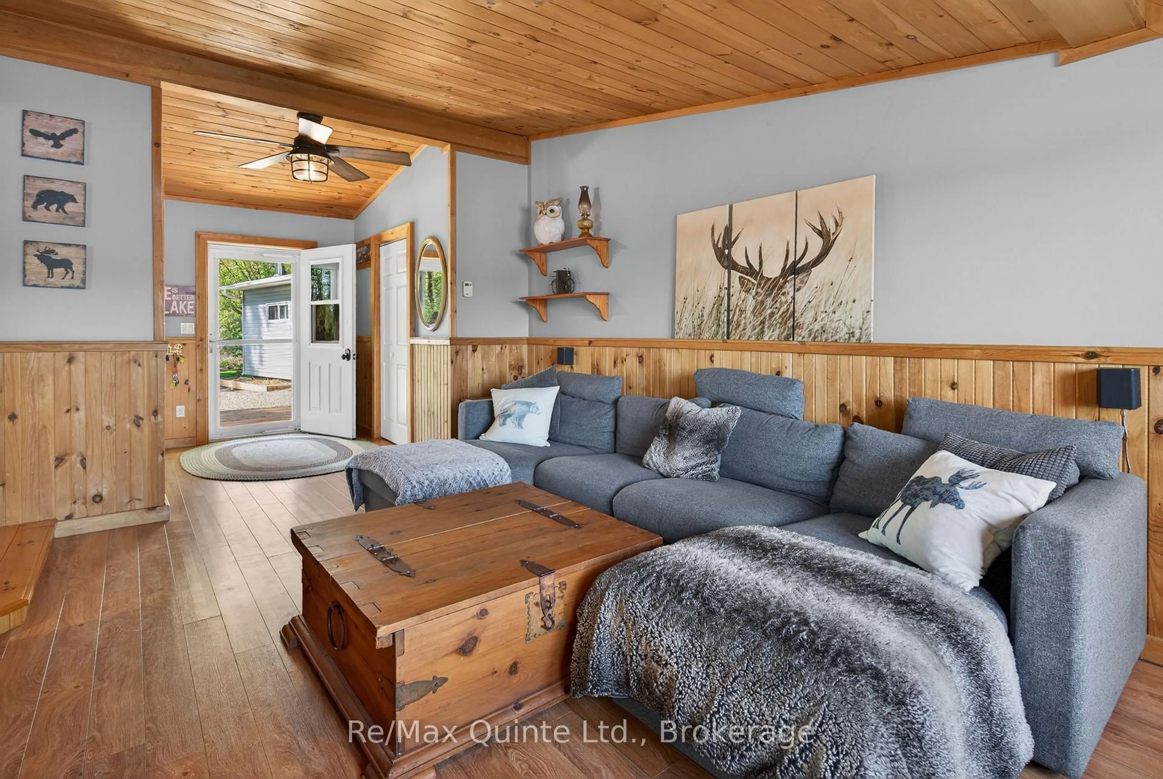 Living room with furniture, wood/laminate floor for 585 Pine Point Lane, Madoc Ontario K0K 2K0