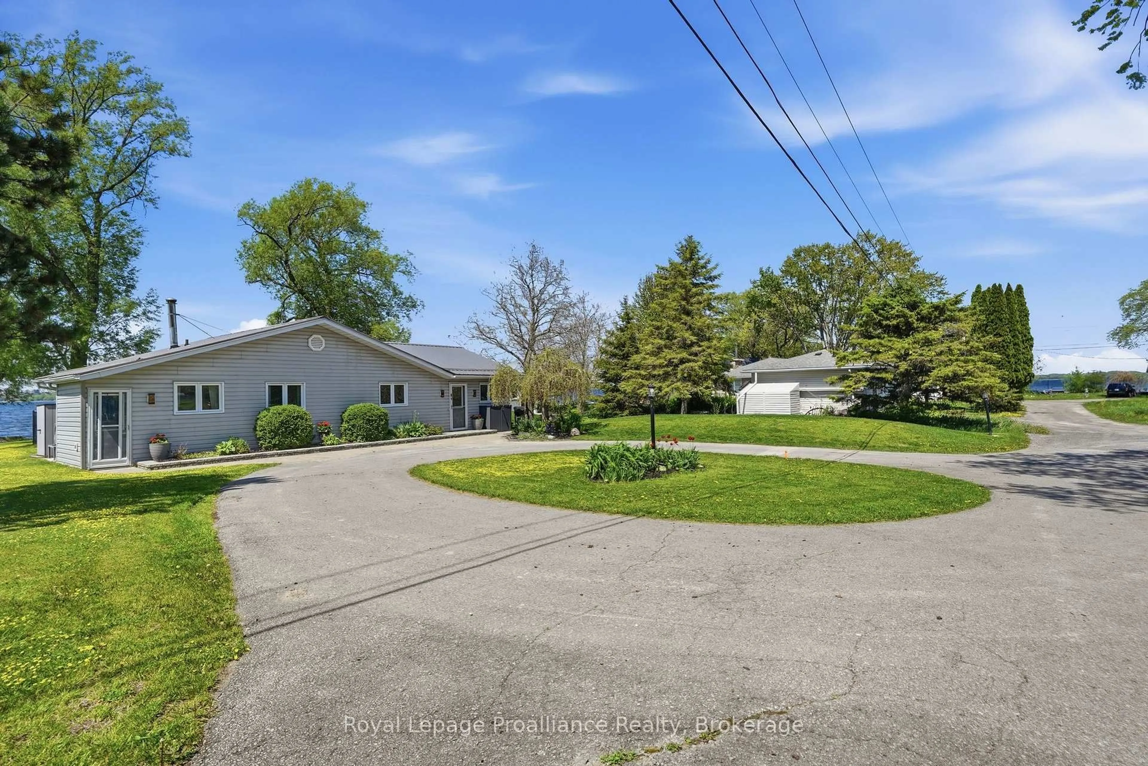 A pic from outside/outdoor area/front of a property/back of a property/a pic from drone, street for 33 Peats Point Lane, Prince Edward County Ontario K8N 4Z7