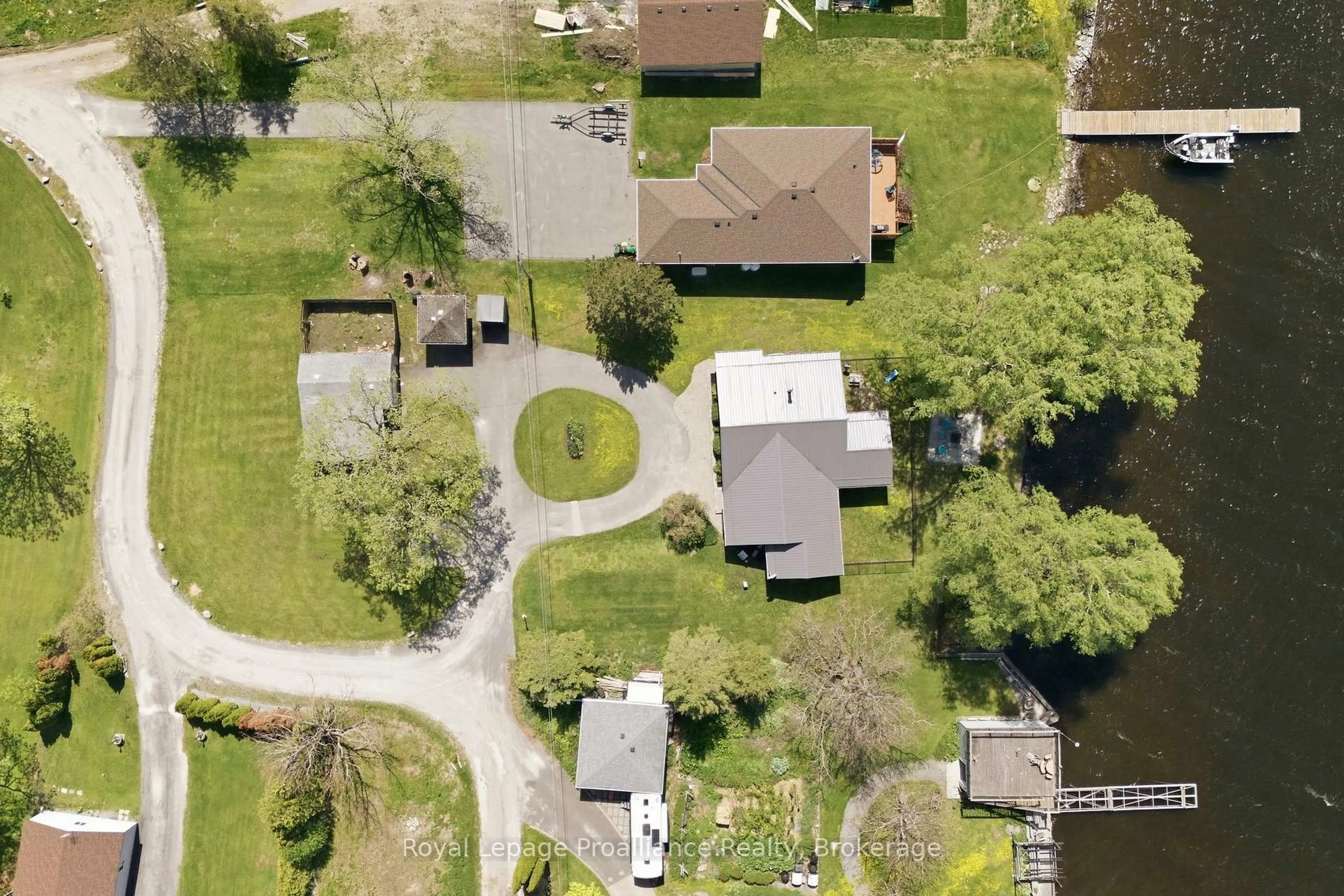 A pic from outside/outdoor area/front of a property/back of a property/a pic from drone, street for 33 Peats Point Lane, Prince Edward County Ontario K8N 4Z7