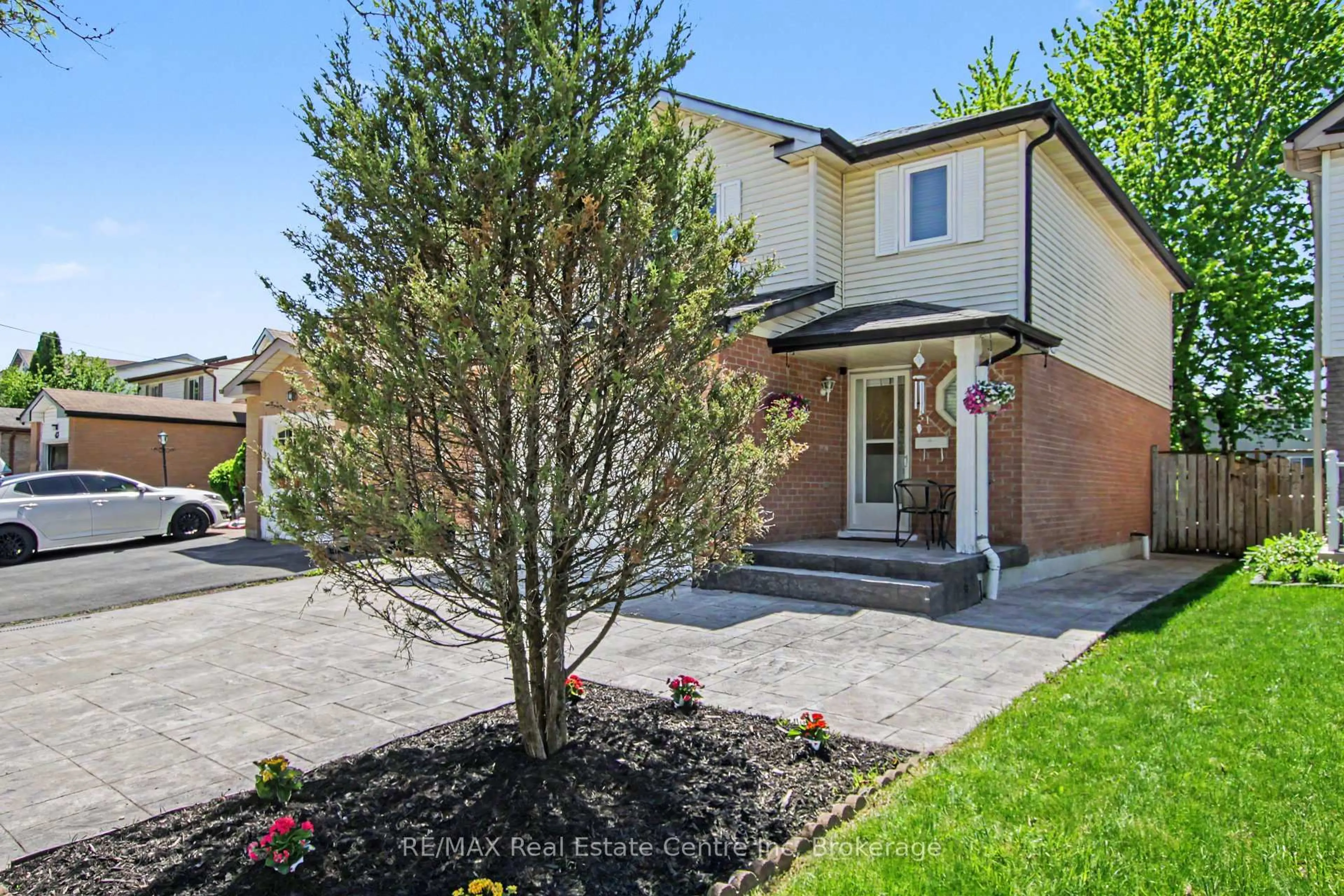 Home with brick exterior material, street for 51 Camrose Crt, Kitchener Ontario N2M 5J4