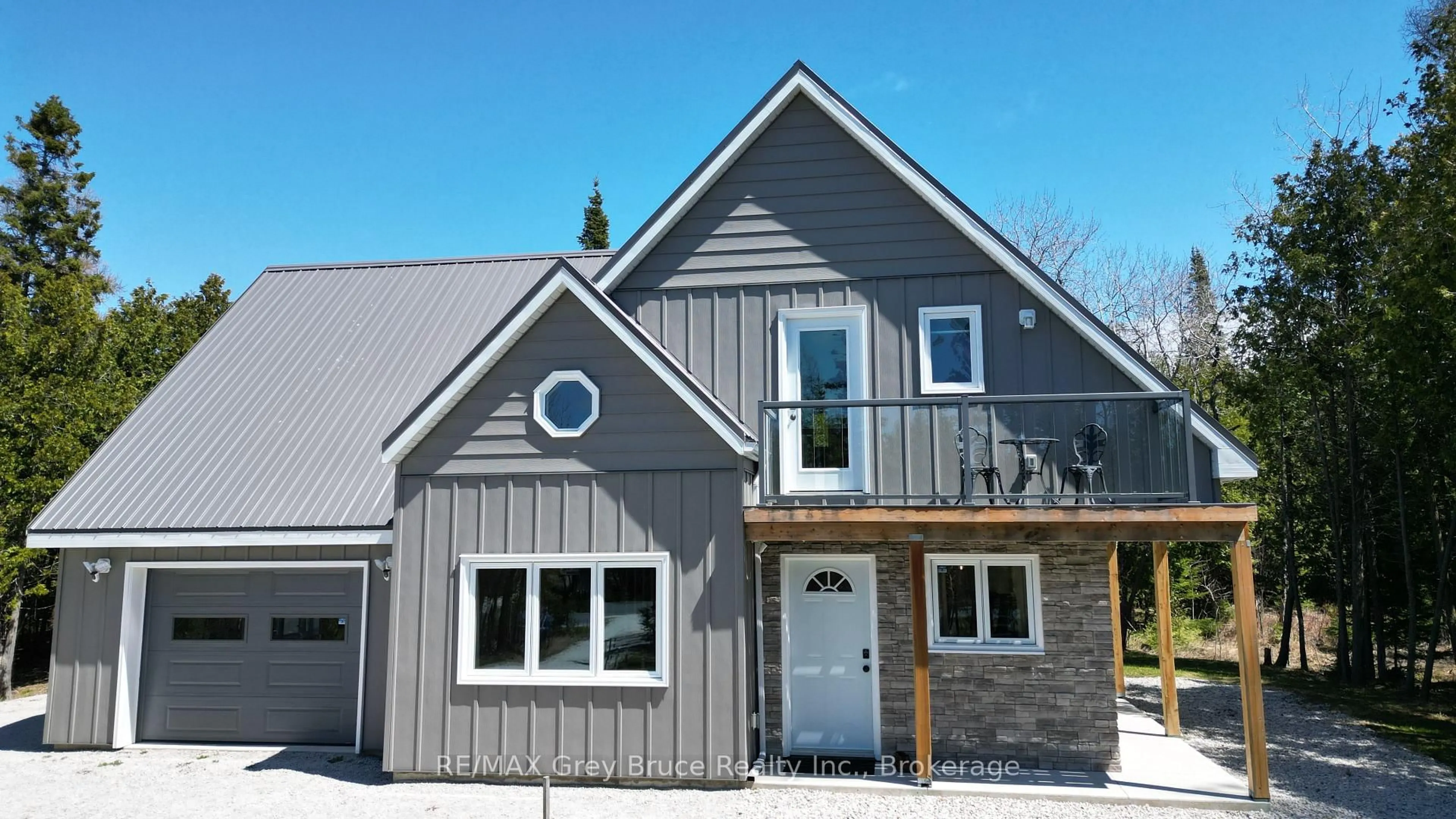 Home with vinyl exterior material, street for 751 Pike Bay Rd, Northern Bruce Peninsula Ontario N0H 1W0