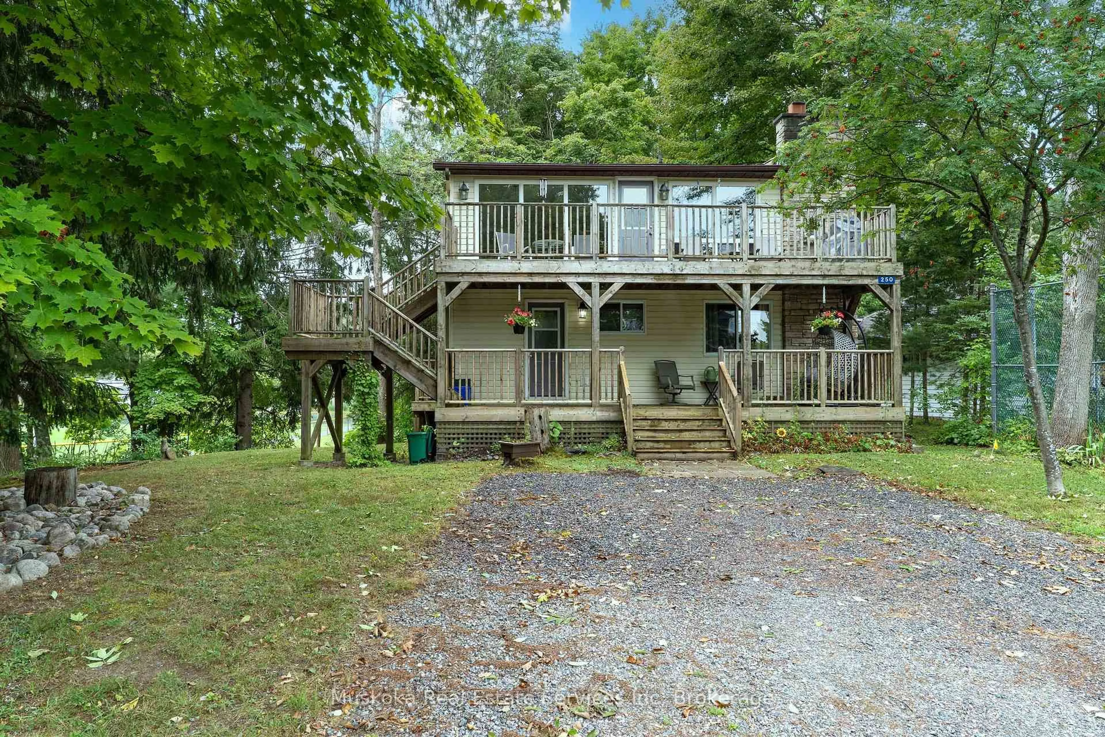 A pic from outside/outdoor area/front of a property/back of a property/a pic from drone, water/lake/river/ocean view for 250 Wapaska Cres, Gravenhurst Ontario P1P 0Y1