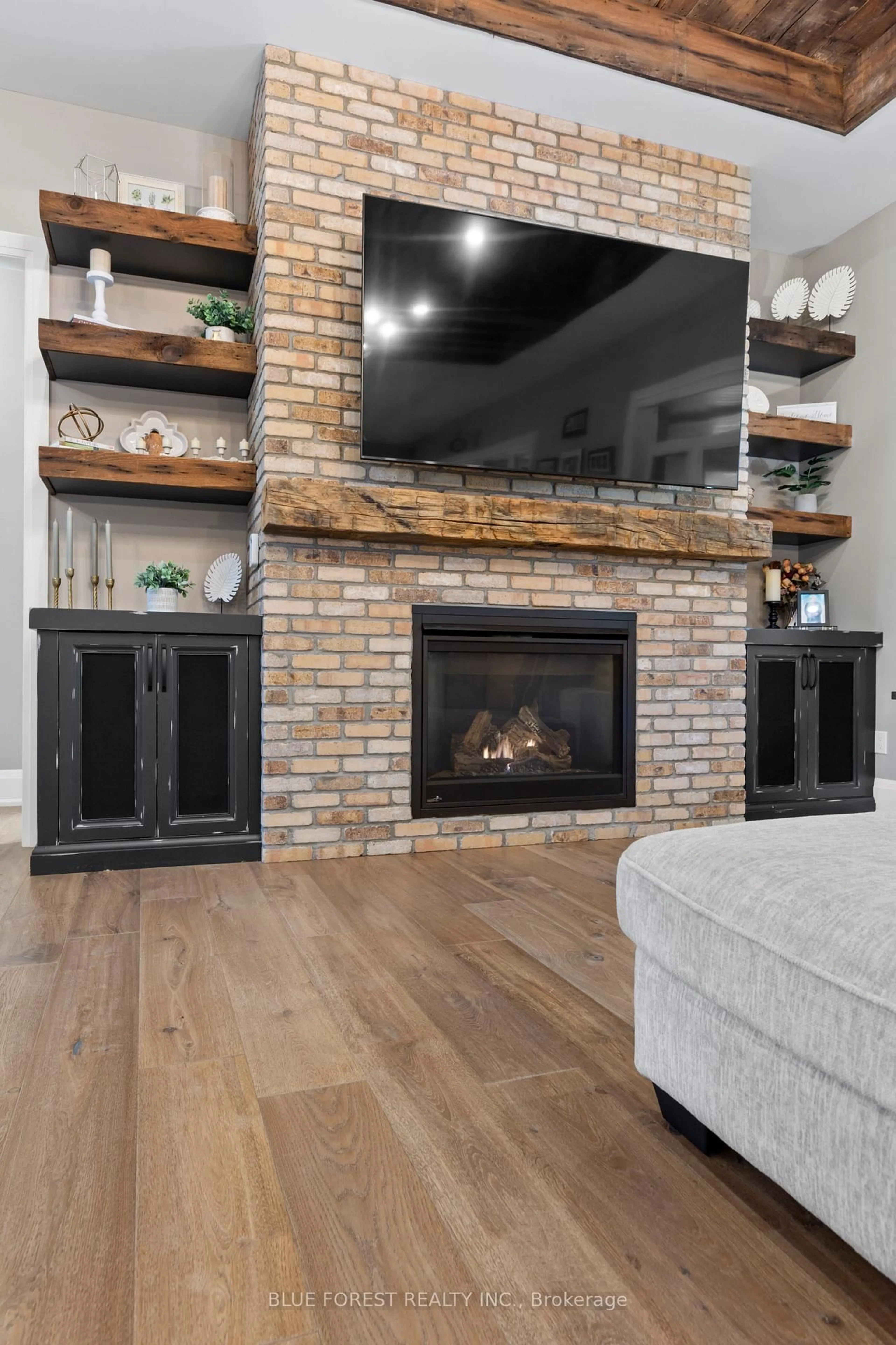 Living room with furniture, wood/laminate floor for 94 Harris Rd, Middlesex Centre Ontario N0L 1E0