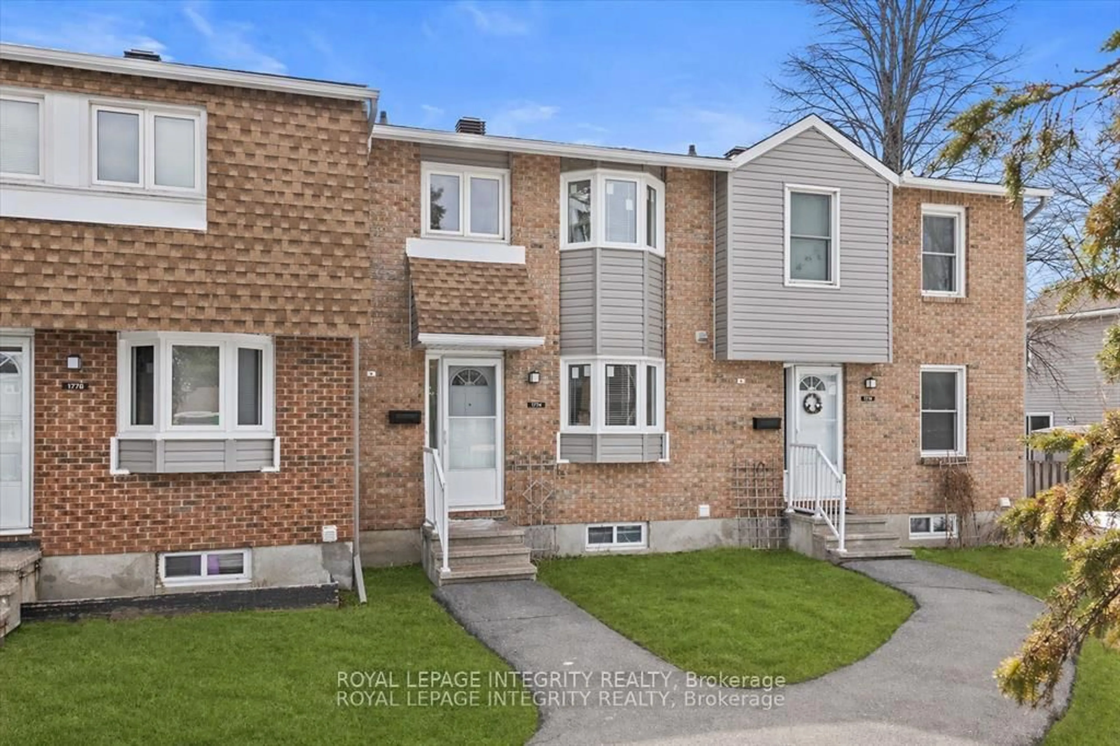 Home with brick exterior material, street for 1771 Lamoureux Dr #C, Ottawa Ontario K1E 2N5